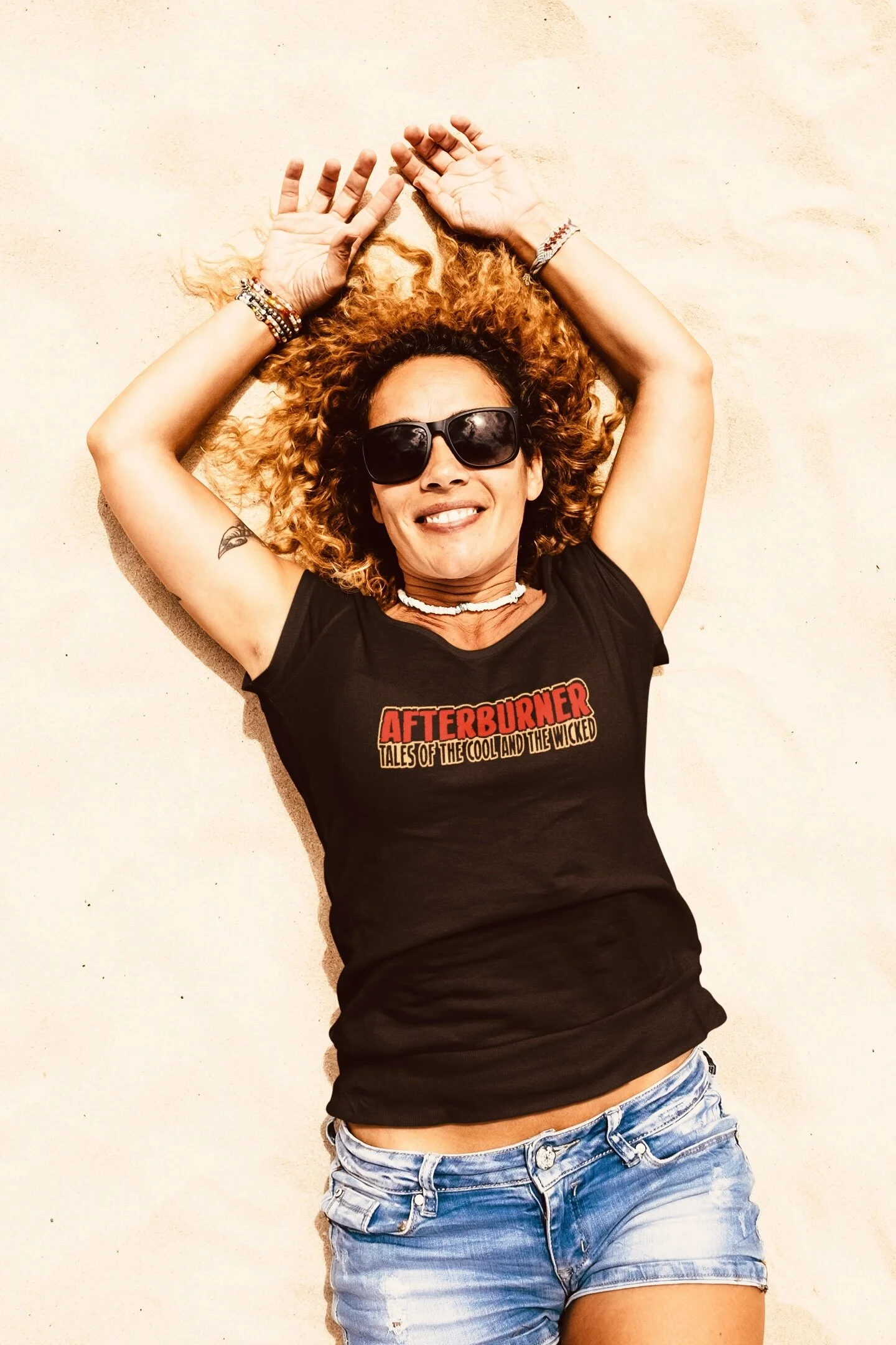 t-shirt-mockup-featuring-a-woman-lying-on-the-sand-45754-r-el2.jpeg