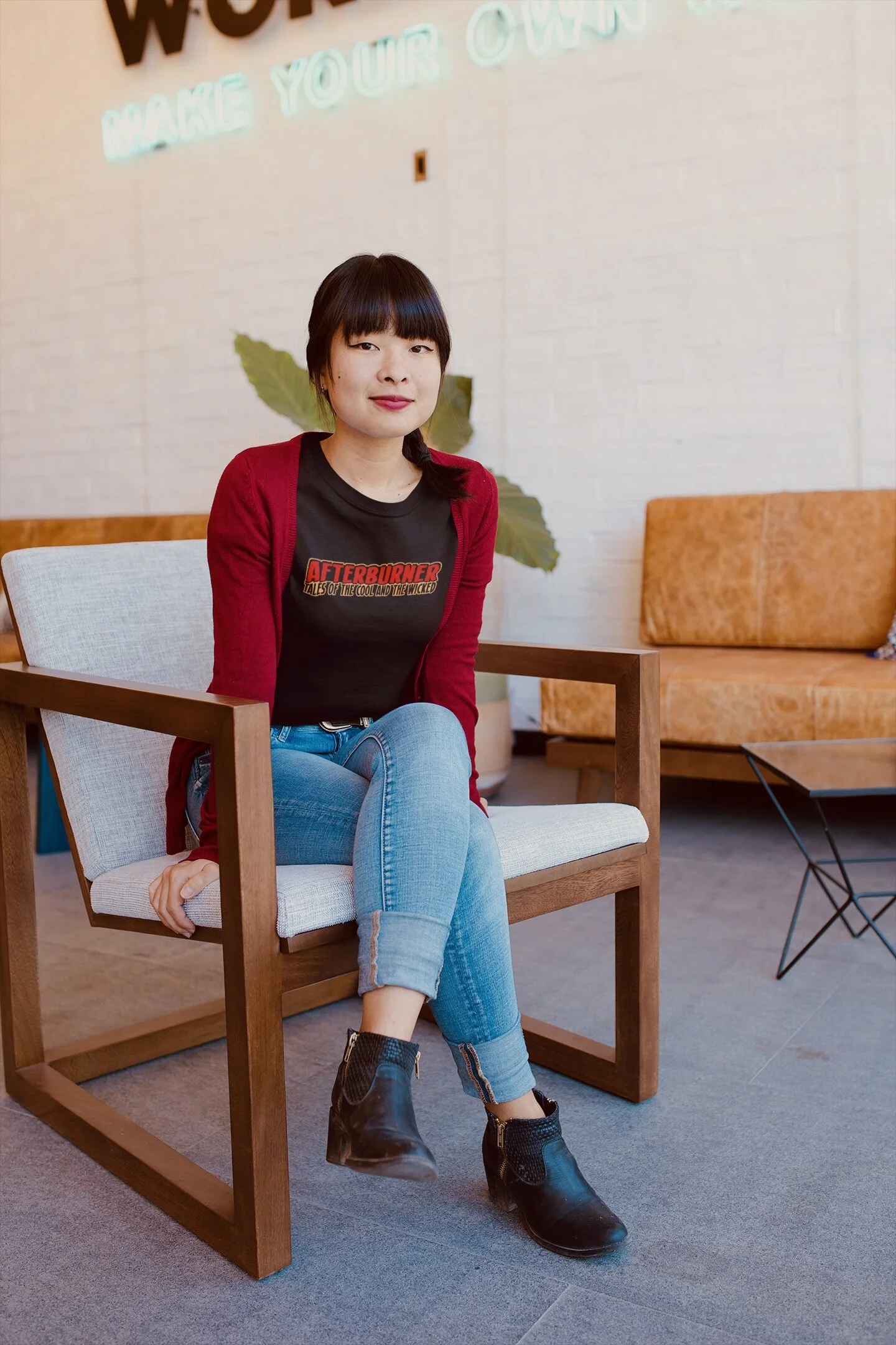 asian-woman-wearing-a-tshirt-mockup-sitting-on-an-armchair-a20408.jpeg