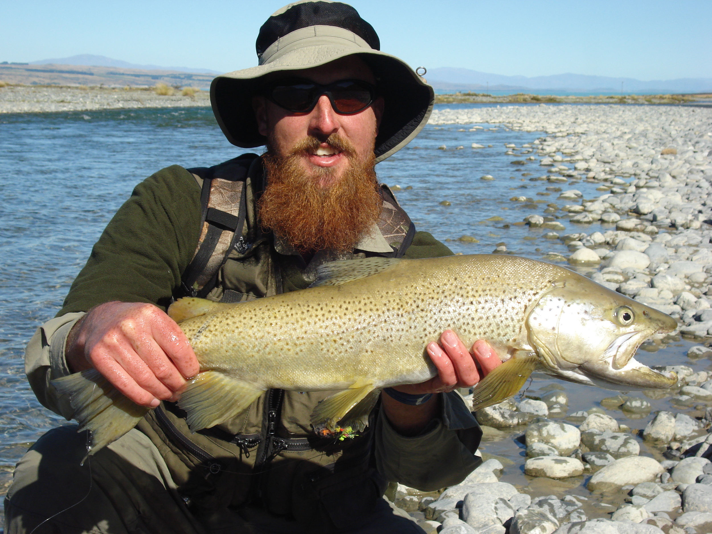Client holding a trophy brown trout from a Twizel river in the South Island of New zealand