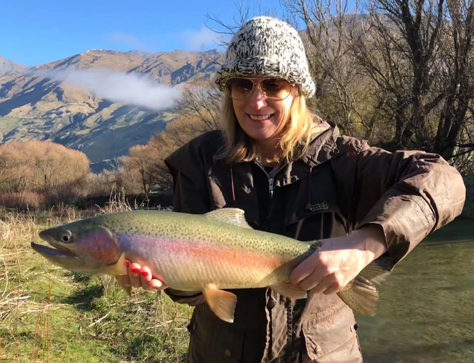 Michelle from Florida in the USA with a great rainbow on her first day of fly fishing.