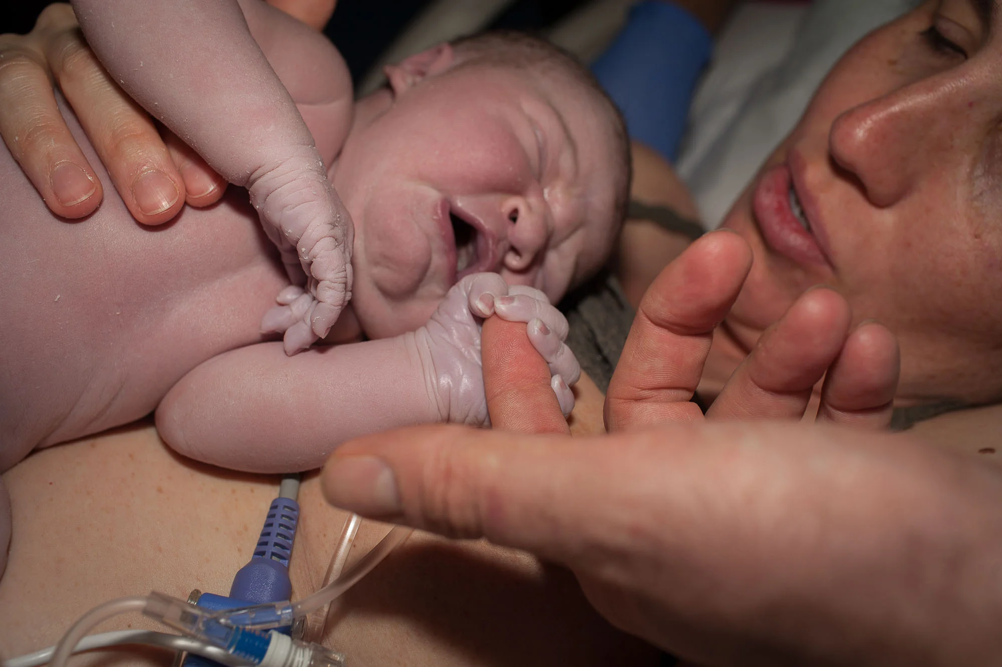 Holding daddy's finger--Austin birth photographer