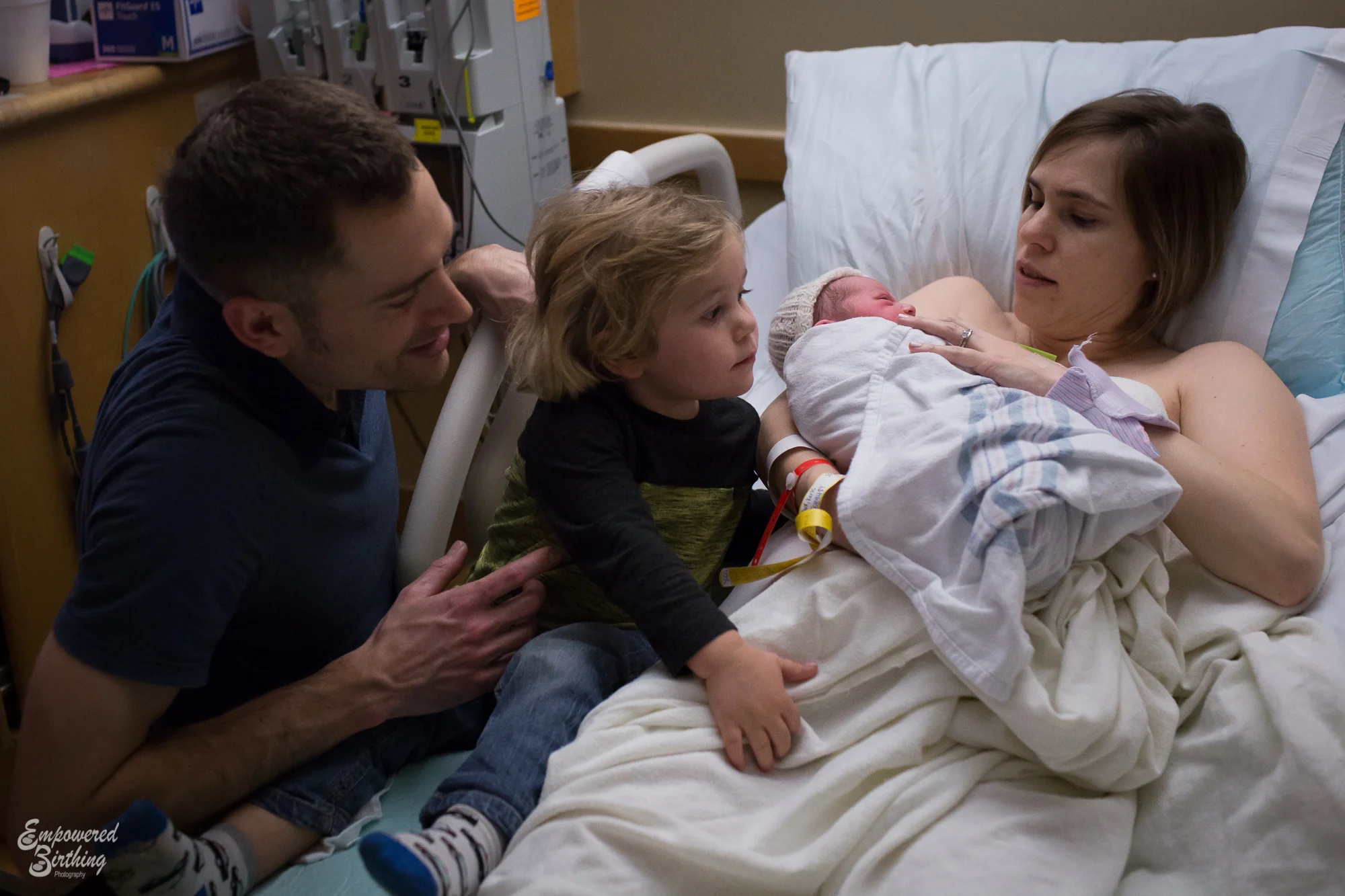 little brother checking out his new sister: austin birth photography