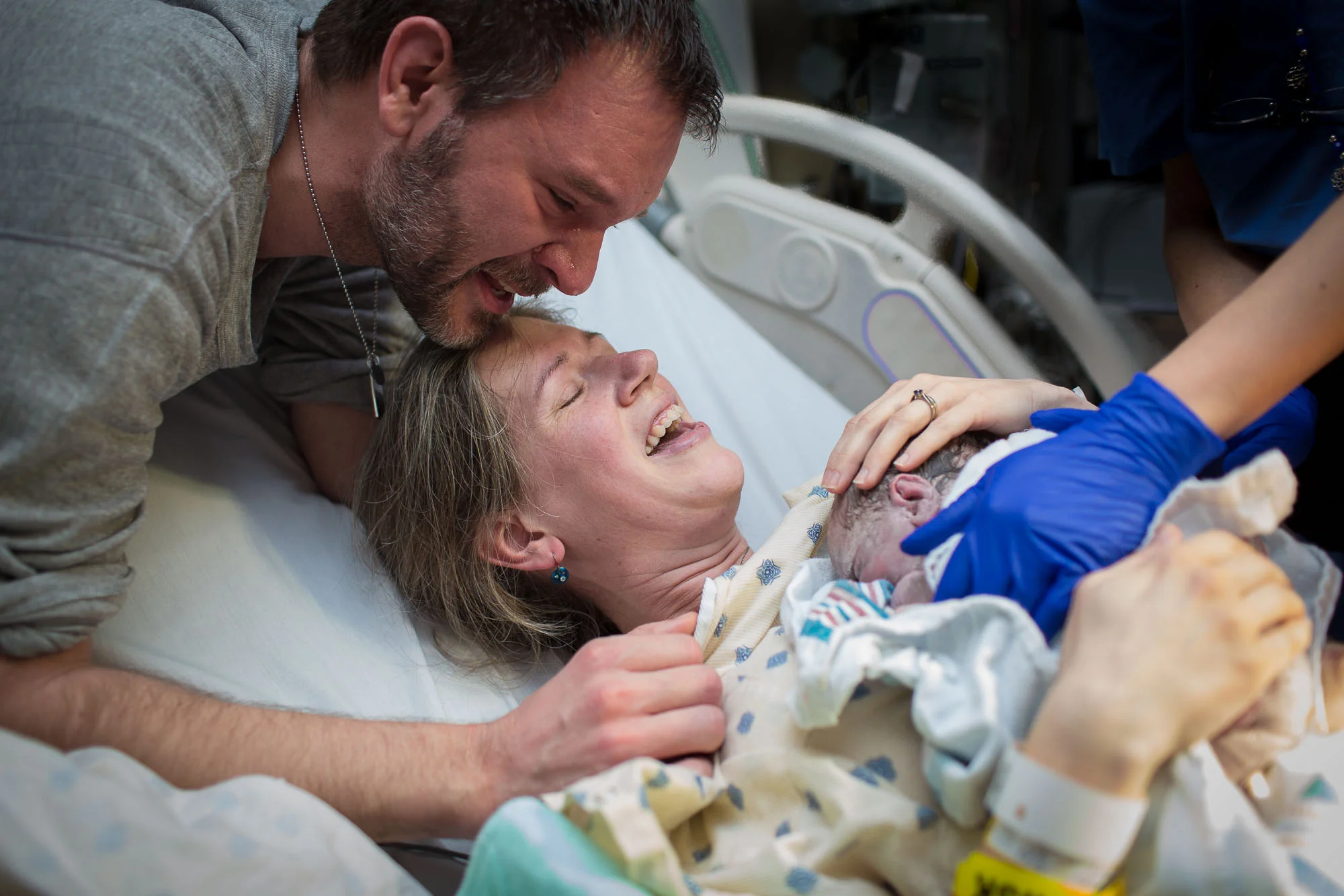 Joy and tears at the birth of their new baby. Austin birth photographer. Austin birth photography.