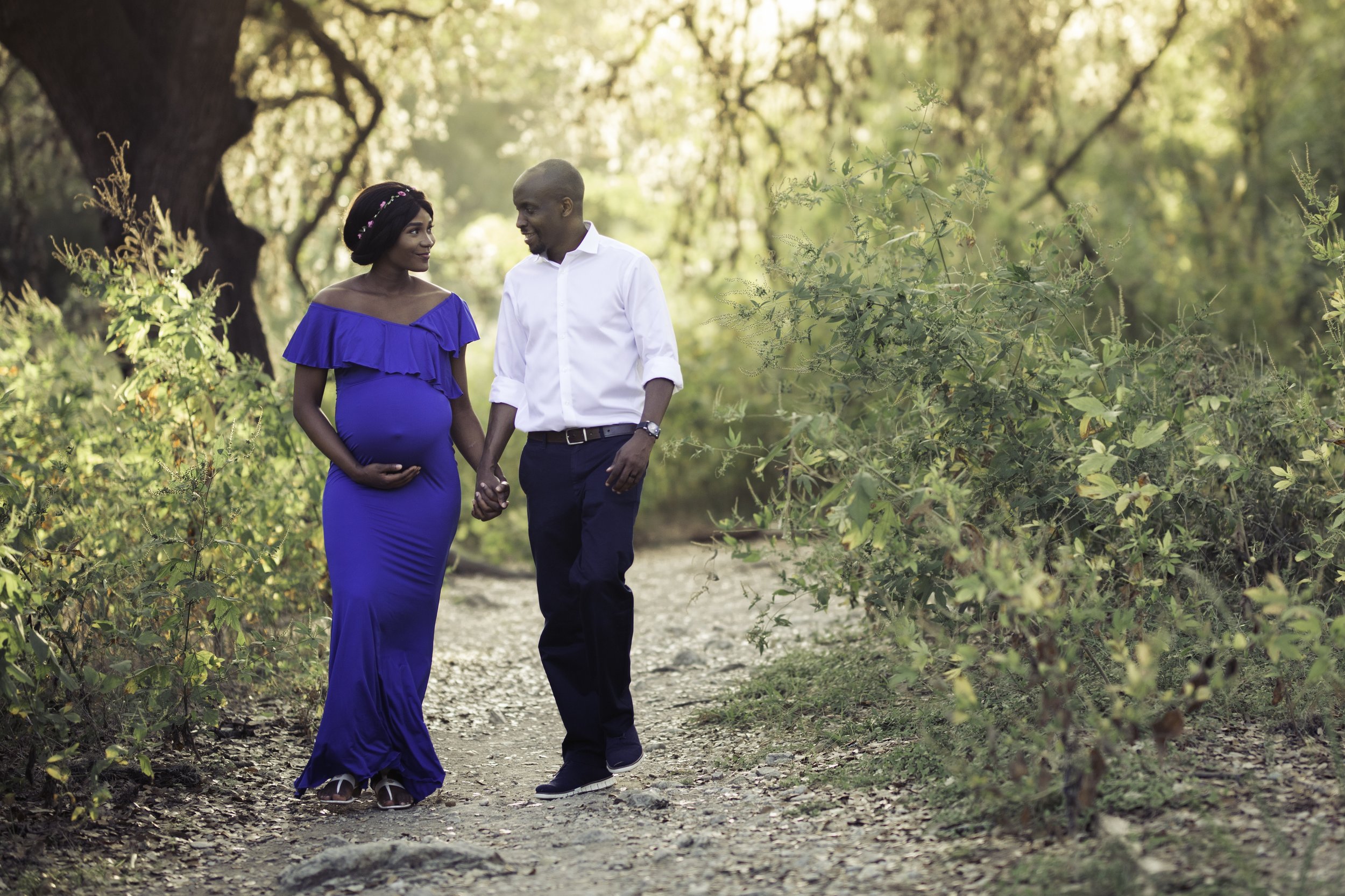  Couple walking together, looking at each other: Austin maternity photography 