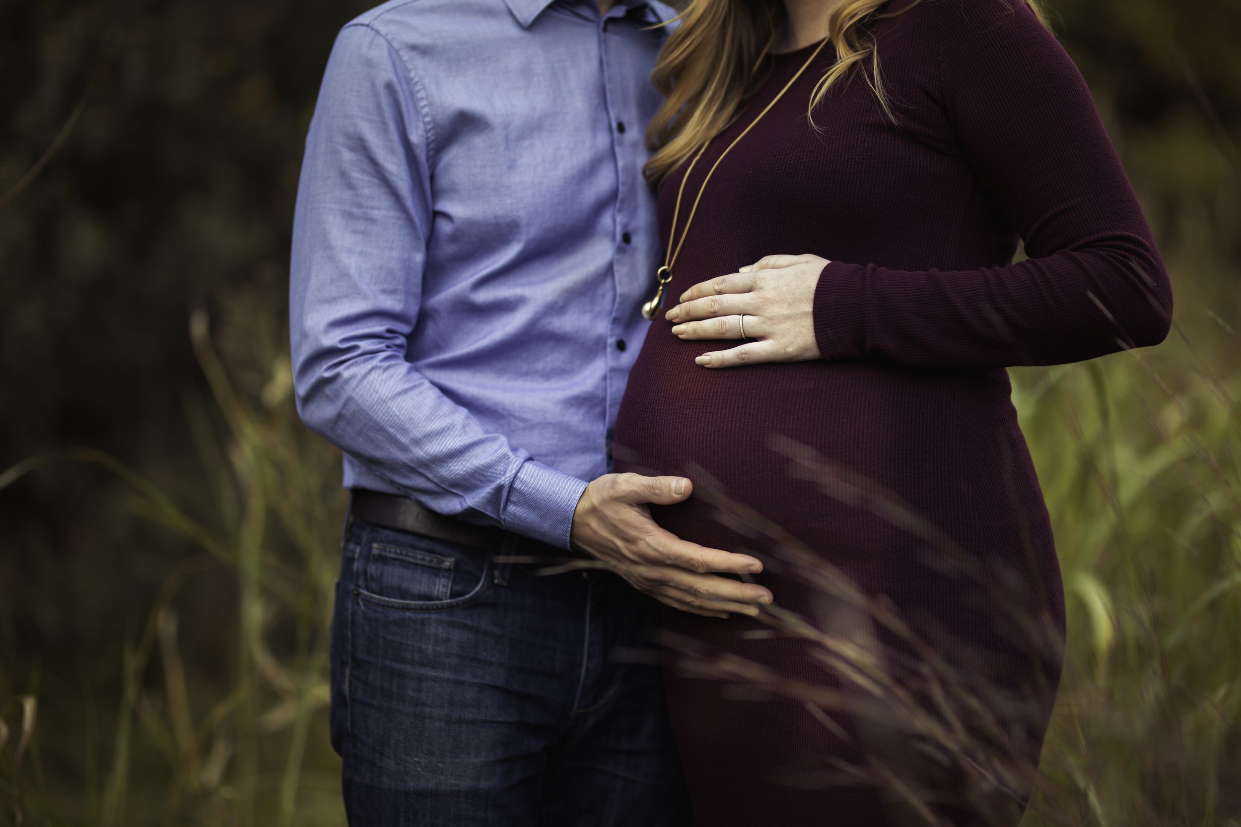  Close up of pregnant belly with partner touching: Austin maternity photographer 