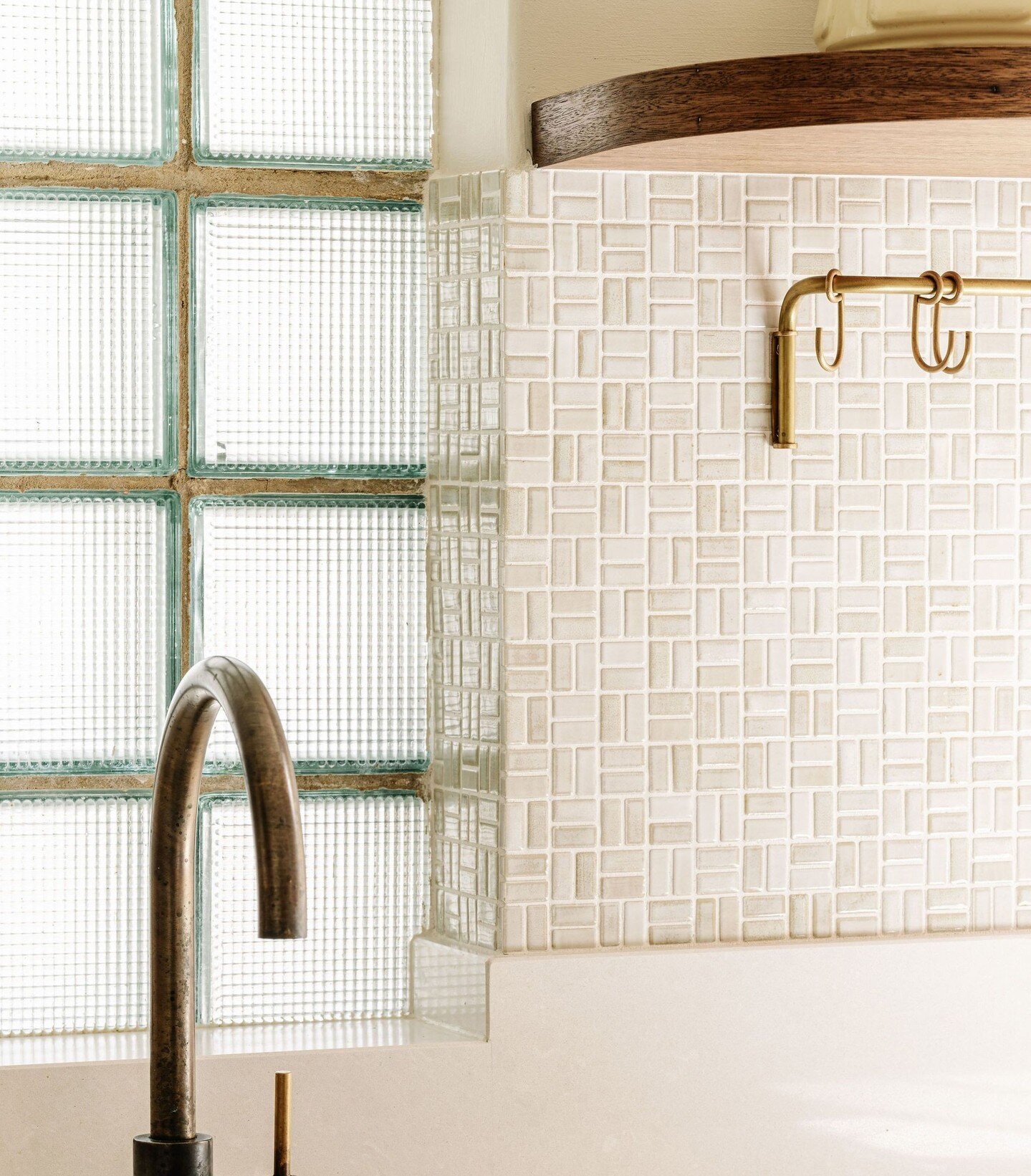 A little close-up of the materials we introduced to our 1938 kitchen. Choosing a tonal mosaic for the kitchen backsplash allowed us to tile into the deep window reveal provided by the solid masonry walls. ⁠
⁠
Paired with an antique brass Faucet Strom