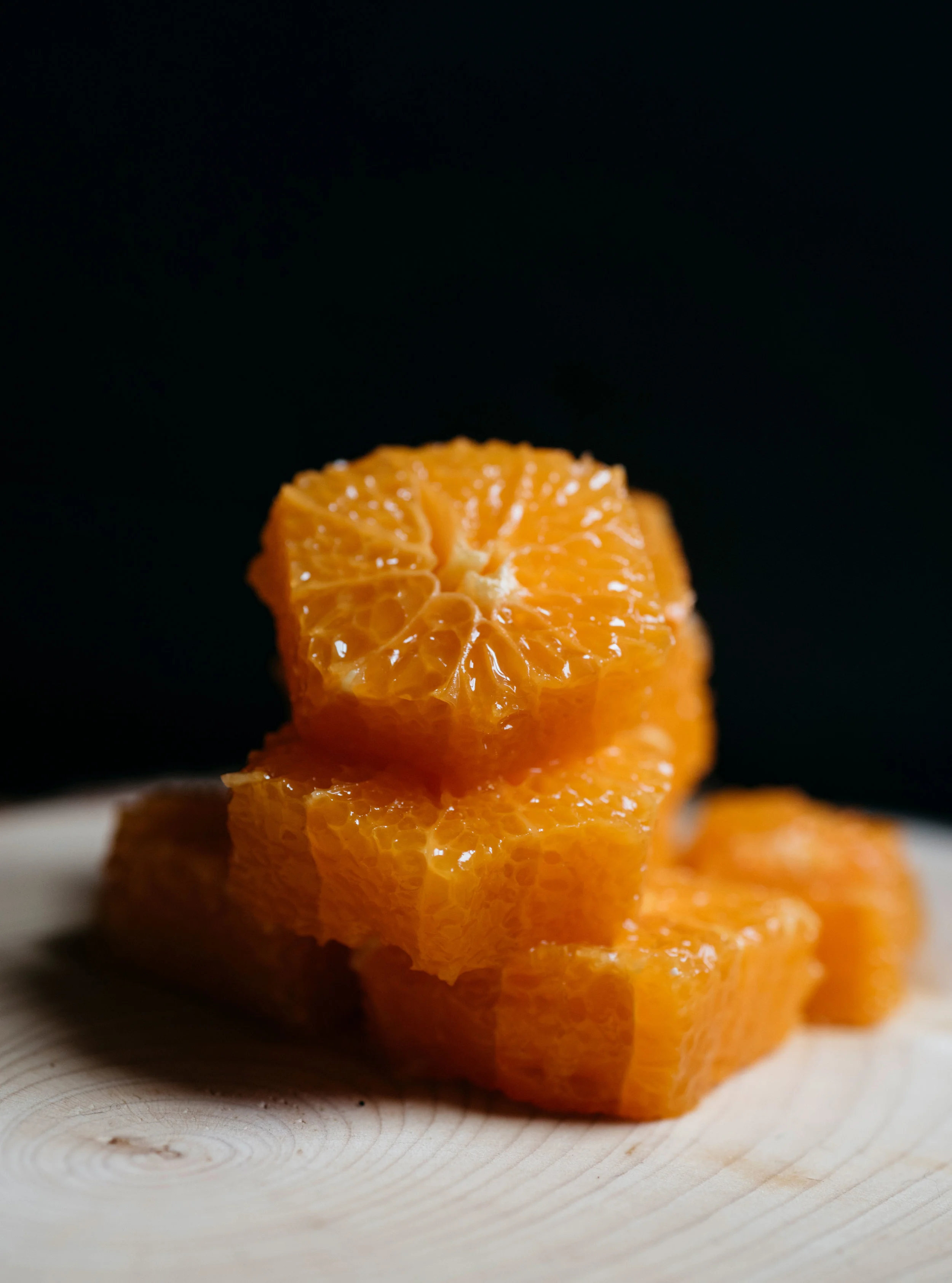 Cut oranges on wood grain