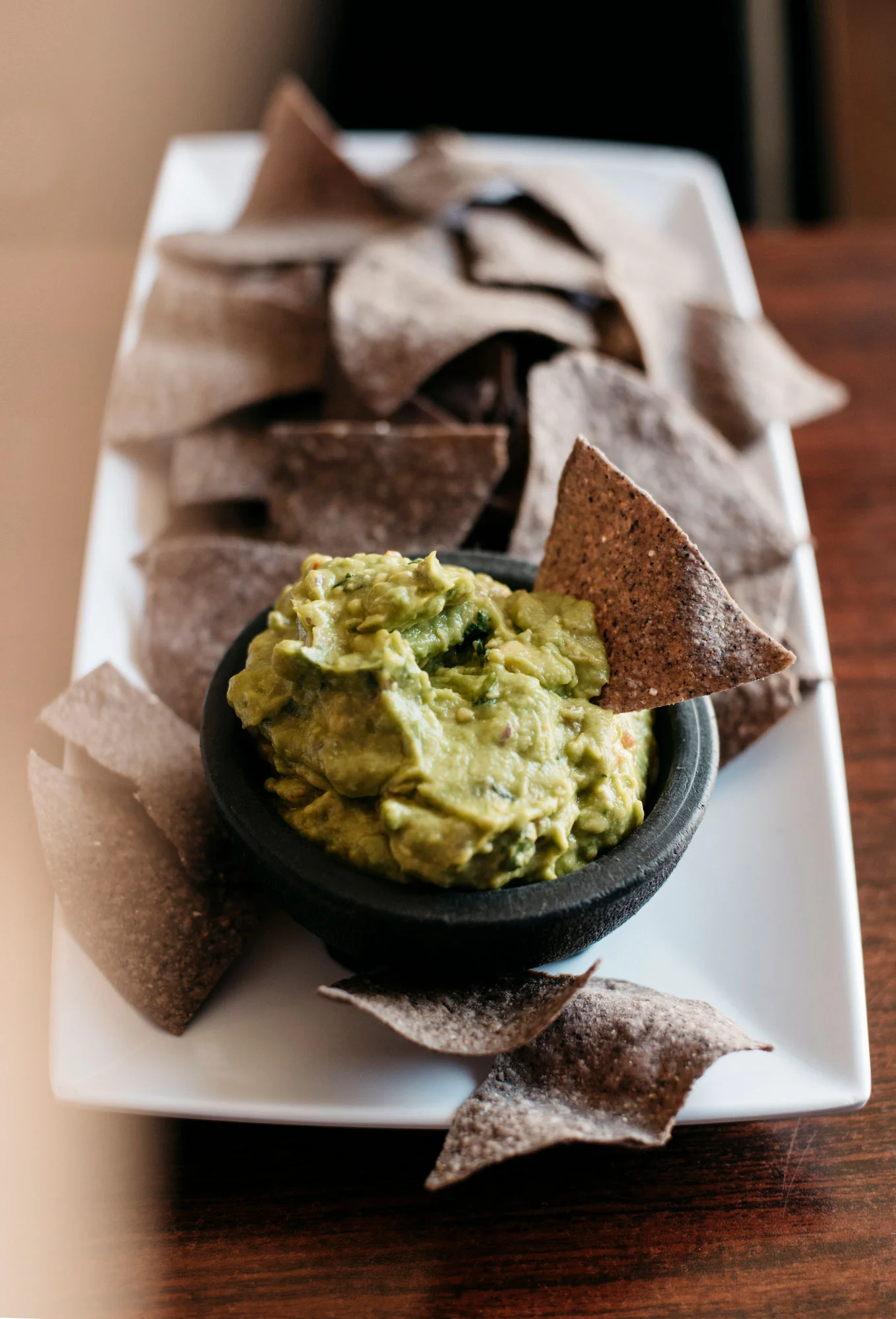 Guacamole and handmade blue corn tortilla chips