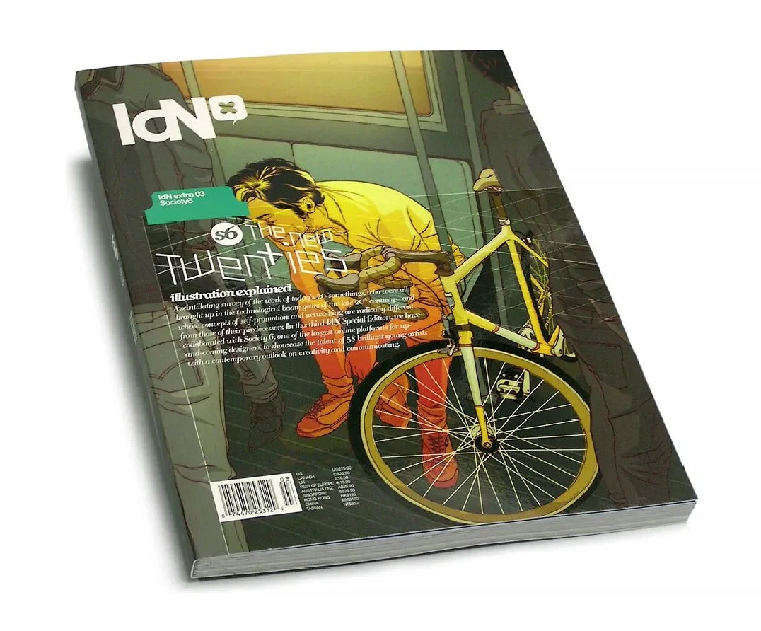Illustrated magazine cover about bicycle design, featuring a person in yellow and orange squatting next to a yellow bicycle, with the title 'ID' and a barcode at the bottom.