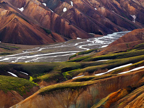 Name: Rivers of Despair, Camera: Hasselblad H1, Lens: 210mm, Film: Phase One P30, Filters: no filters. The view from below the top of Blahnukur. Amazing structures defined by rock shapes and colors are to be photographed near Landmannalaugar. I saw some aerial images of Iceland that were breathtaking and very graphic. One day I will rent a plane to witness and shoot them but before doing so, this image has to fill in. On my way up on Blahnukur, the highest peak of Landmannalaugar, I was trying to capture some of the colorful patterns of the rhyolite volcanic rock that typically surrounds the area.
