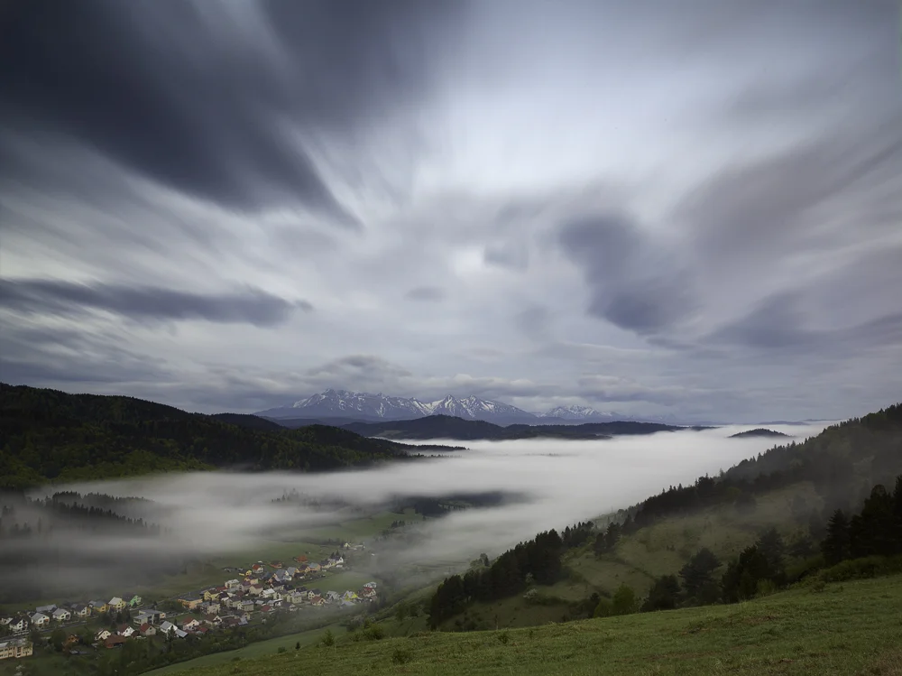 Lesnicke sedlo & The Village: I was leaving Kezmarok with the clear sky above me thus with no high hopes. One hour later, this is what I found just 50km farther. Shot some 30 minutes before sunrise, for one and a half minutes. The uncovered sleeping village pointing towards the land hidden below the mist, together with dynamic sky created some sort of the contrast that attracted me. Camera: Hasselblad H1, Lens: 35mm, Digital back: Phase One IQ140, ISO: 50, Filters: Lee ND 0.9, Lee ND Grad 0.45 Soft.