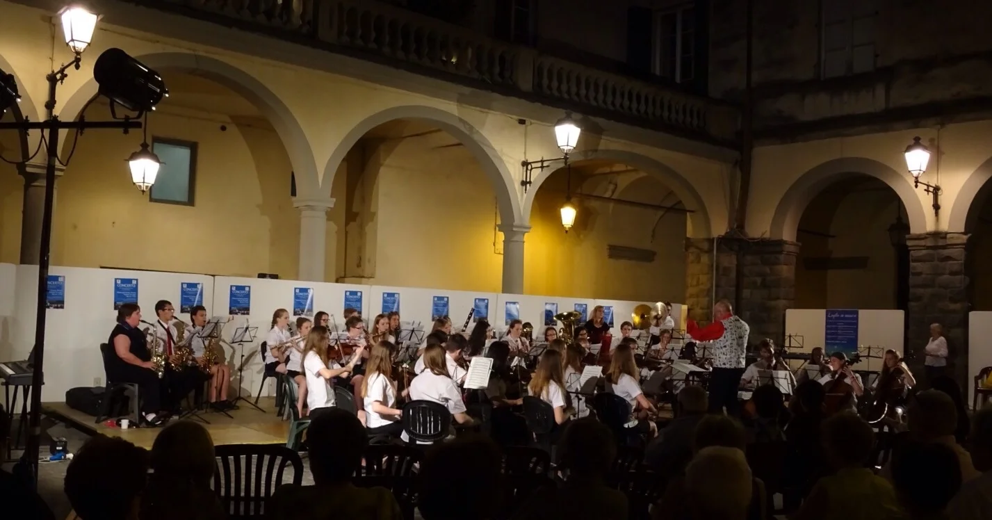 Playing in the open air town square.