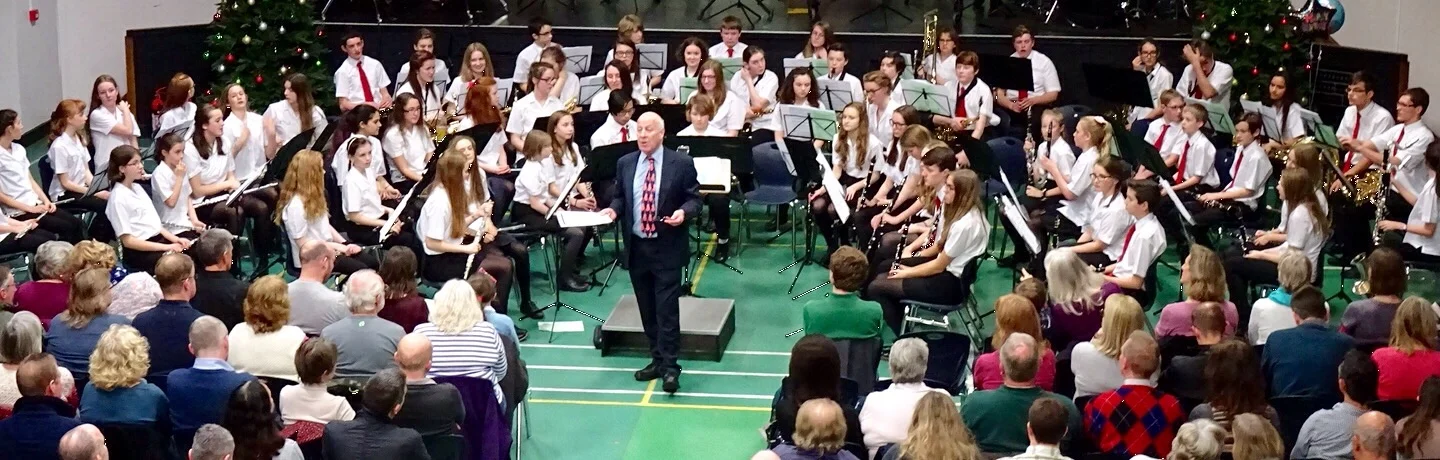 Wind Orchestra Being introduced by John Fuller.