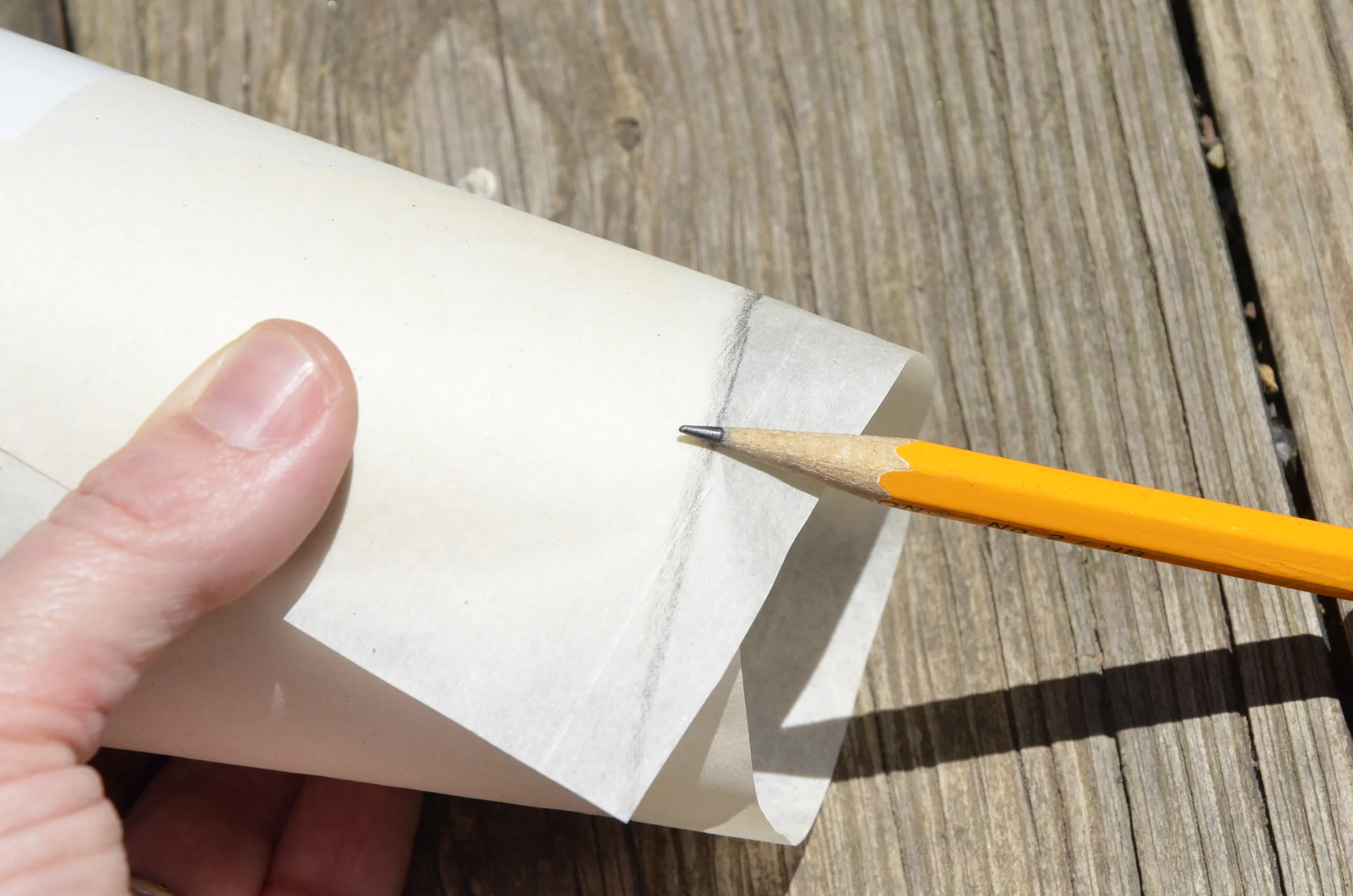 Use the side of a sharpened pencil to trace along the cutting edges.