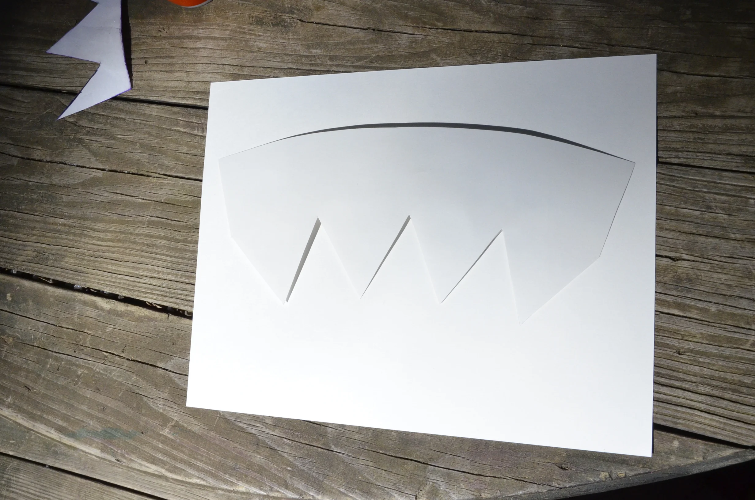 Heavy-weigh paper template is taped to the backside of the decal sheet to trace for precise cutting.