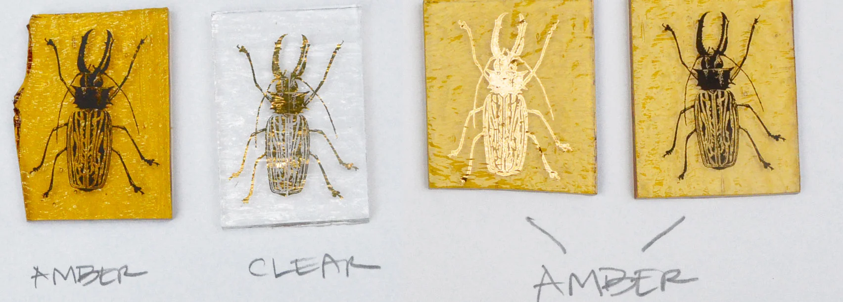 Test 4 on the left. The clear with gold decal will go on top of the amber with the black decal. Test 5 on the right. The amber with gold decal will go on top of the amber with black decal.