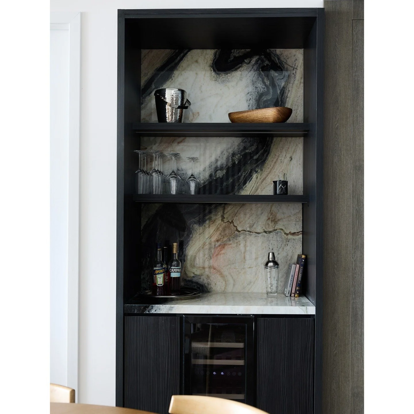 A U R O R A
.
.
.
We designed and built this custom bar for a special client in Sunny Isles. A sleek, functional space to craft cocktails in style. Handpicked Botticelli marble for the countertop and backsplash pairs with warm wood cabinetry to creat