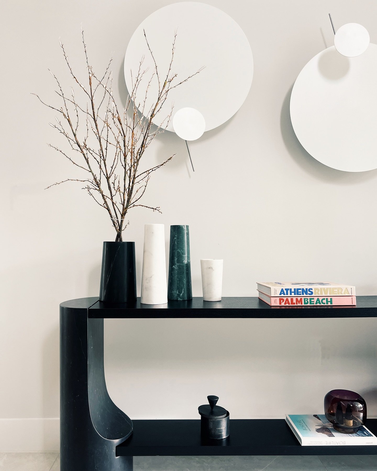 C Y P R E S S  H O U S E 
.
Entrance 
. 
We wanted to give character to the double-height space with the Bocci pendant, creating a sculptural effect with the console while keeping it warm and inviting through books, candles, and personal details.
.
#