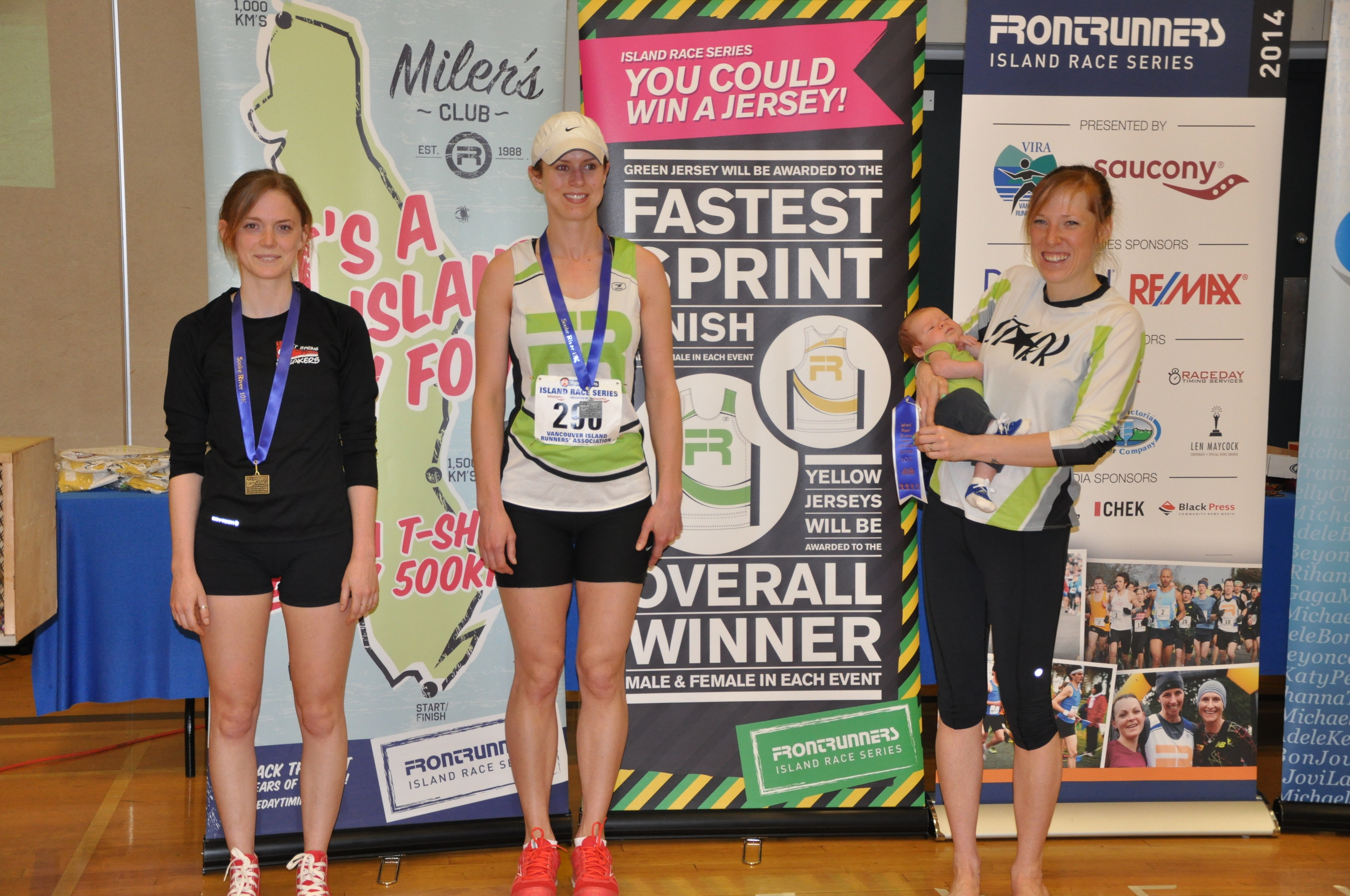  Sara-Mae (and son) accepting her&nbsp;Age Group award&nbsp;at the Sooke (Island Series)10km - 2014 