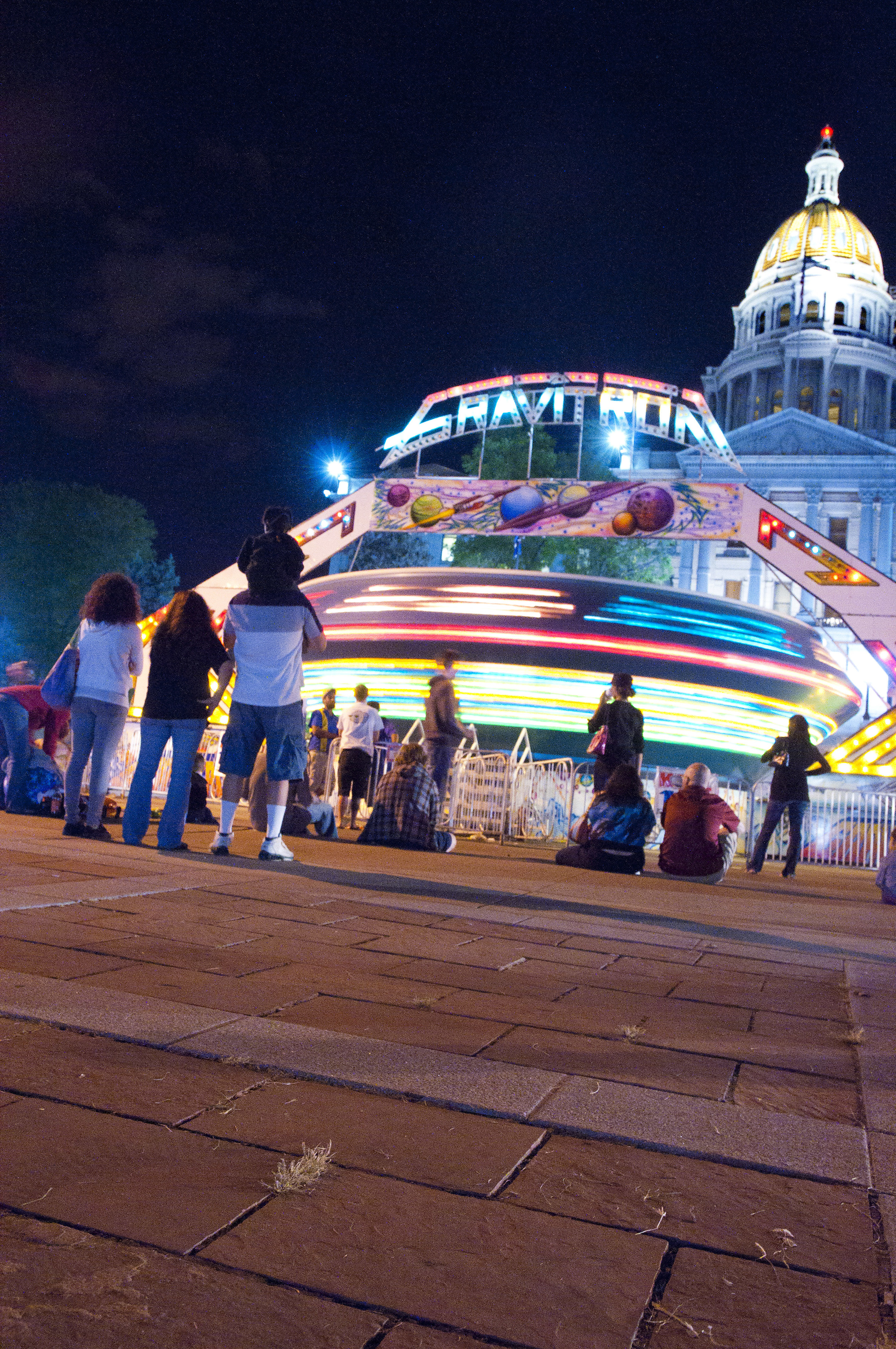  The Taste of Colorado winds down in front of the Colorado State Capitol as the festival's rides spin the last of their riders. The yearly festival brings huge crowds to Denver's heart over Labor Day weekend. 