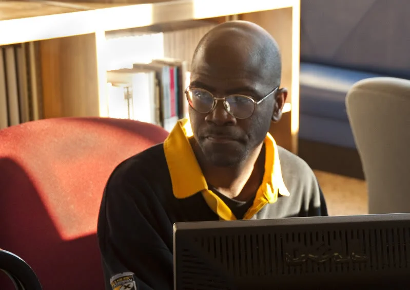 Charles Matthews checks a book into the Gary Public Library’s system on the last day of the Central branch’s operation.