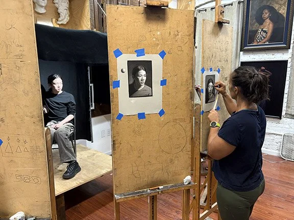 small image of students working around model.jpg