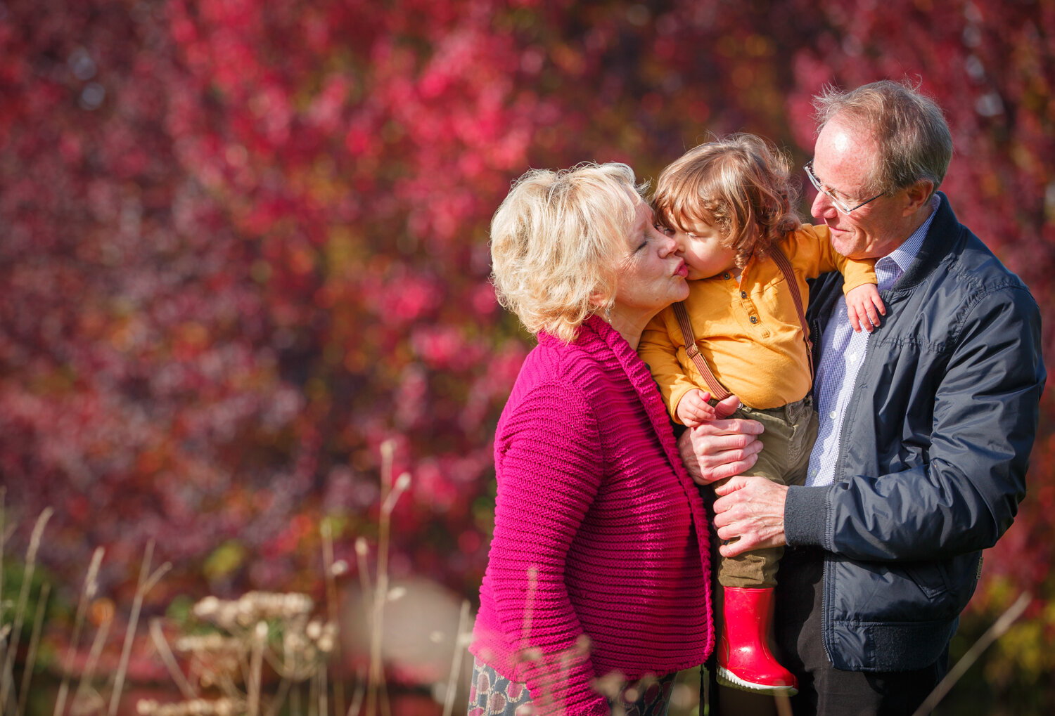 berkshire family photographer grandparents kissing grandson