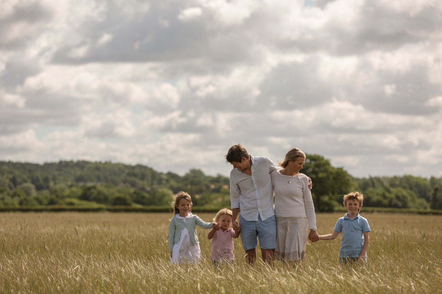 berkshire family photographer family of 5 walking through wheat field