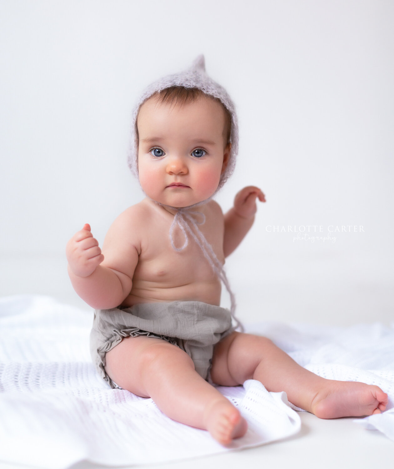 reading baby photographer berkshire sitting baby portrait