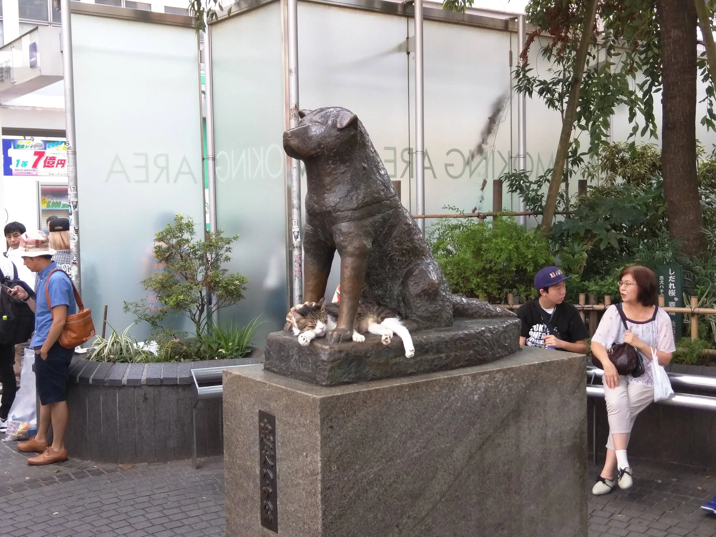 Bronze statue of Hachiko in front of the train station at Shibuya, Tokyo.