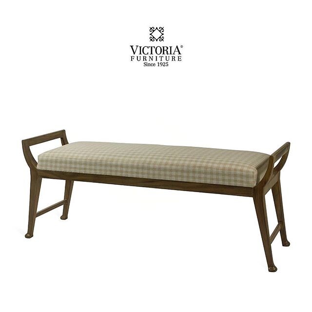 A contemporary bench with a unique finish shows off the wood grain on this piece.