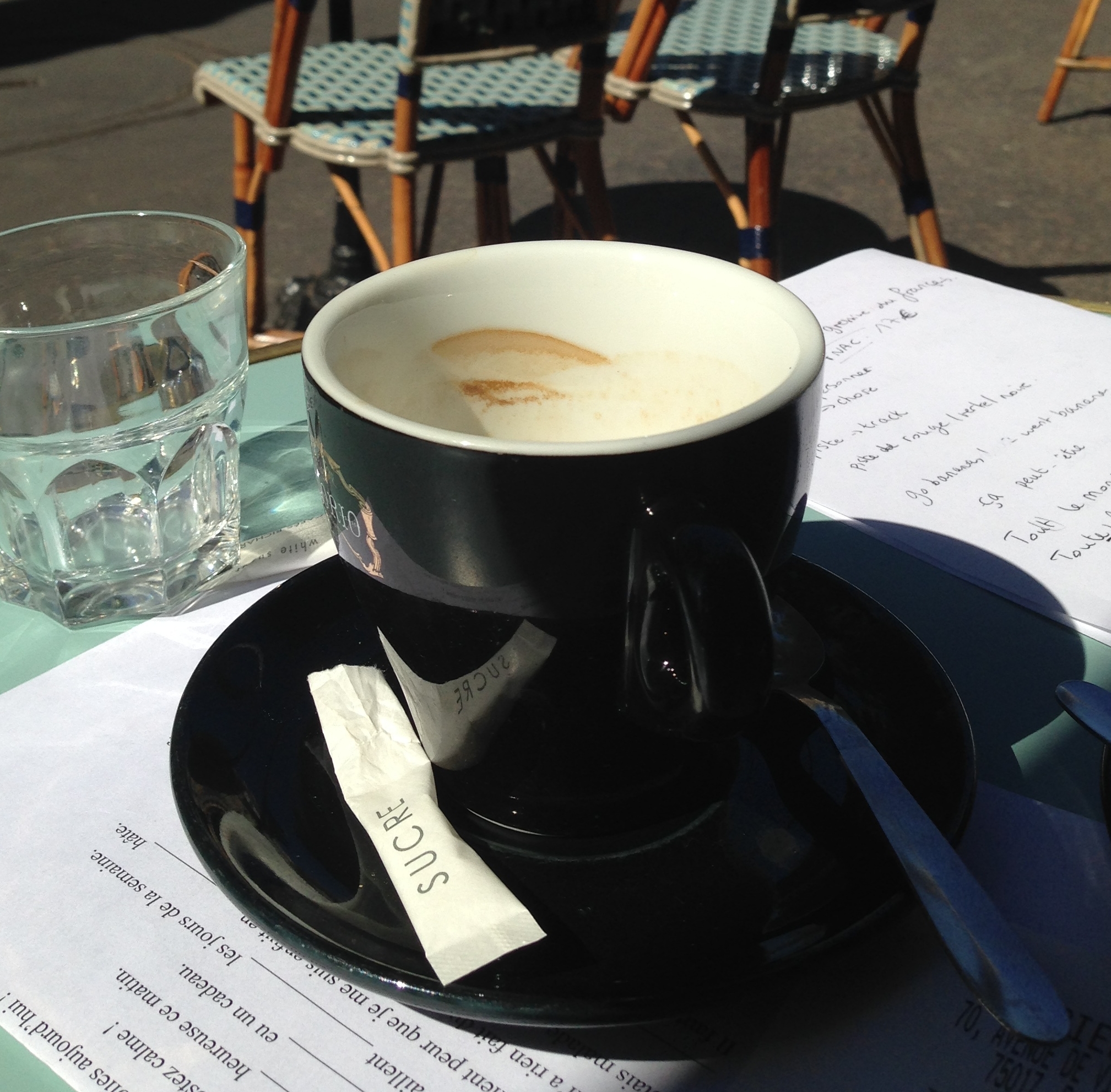 French class with coffee and wicker chairs.