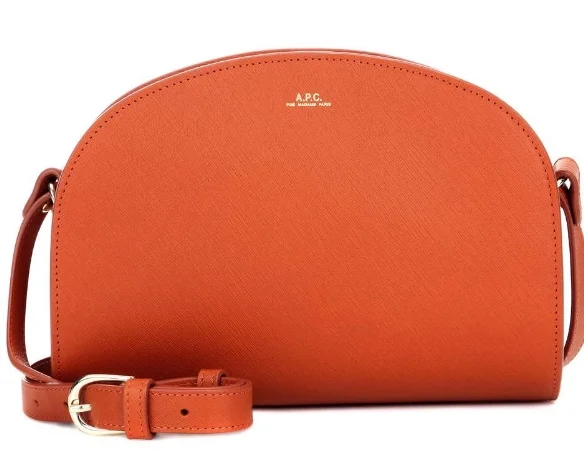 The APC 'half-moon' bag has a cult following. Grained leather is a pleasure . This one from mytheresa.com .
