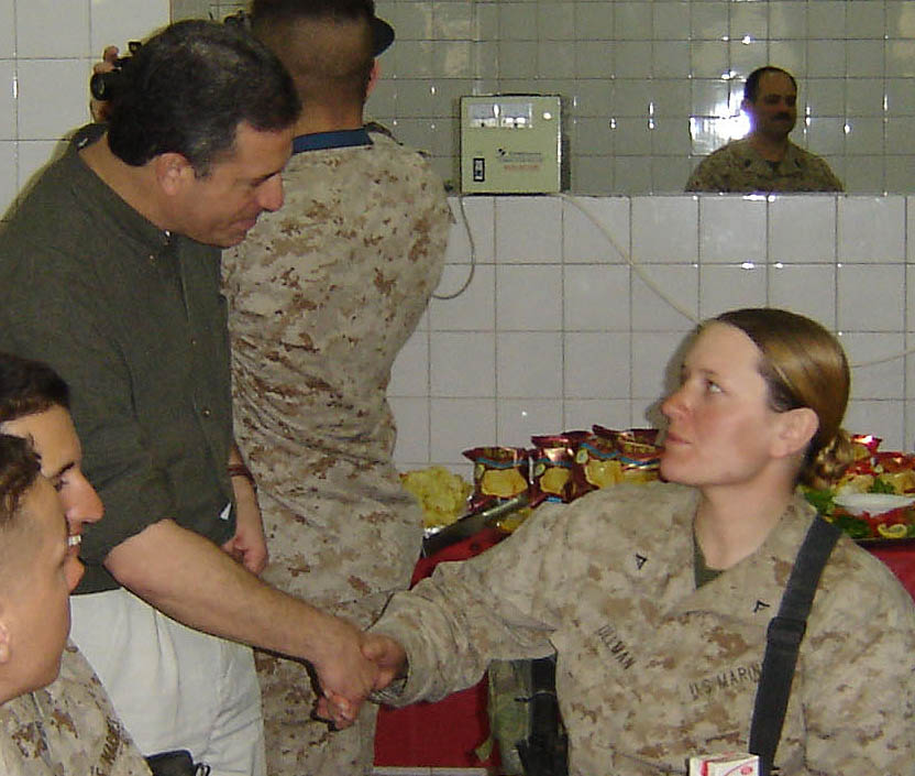   Cpl Stephanie Ullman being congratulated by Wisconsin Senator Feingold for her combat award during a congressional visit to Fallujah, 2005.     