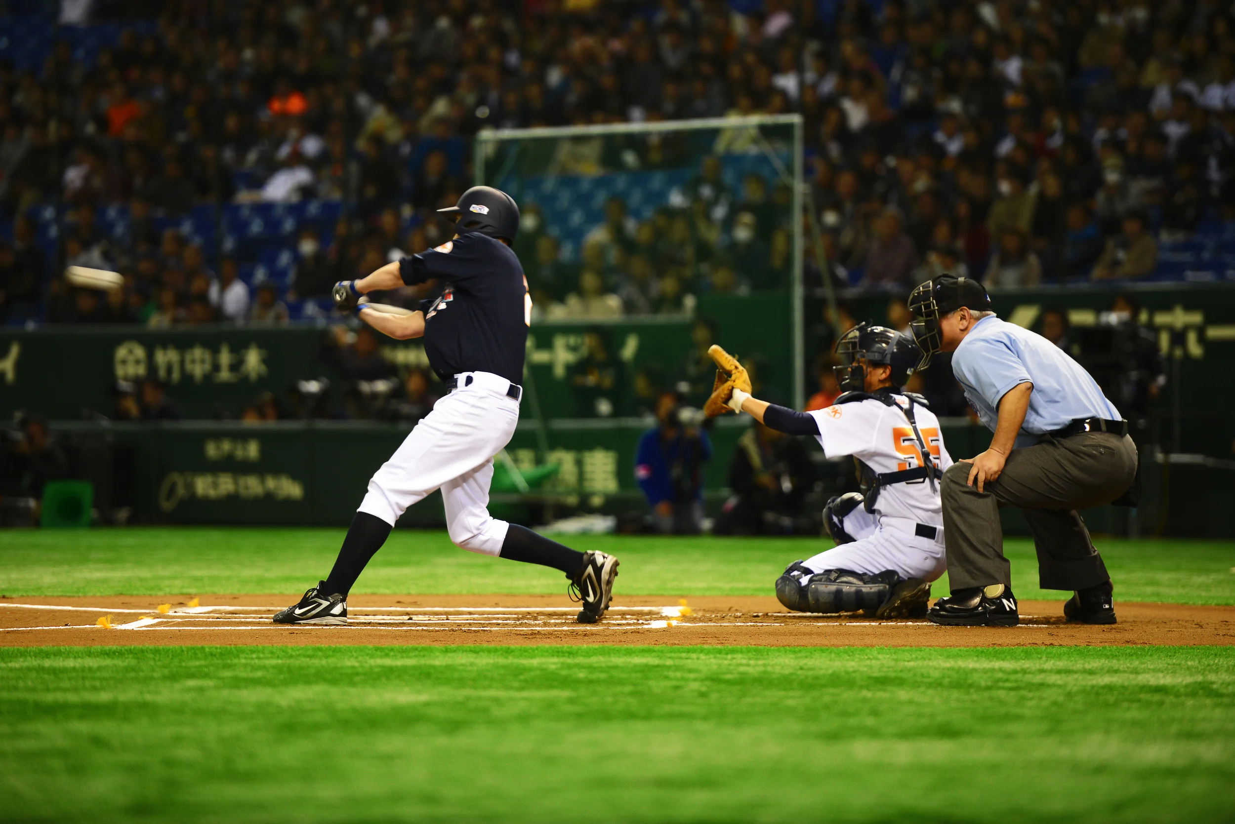A member of Team Jeter swings at an incoming pitch during the Tomodachi Charity Baseball Game, March 21, 2015, at the Tokyo Dome, Japan. Derek Jeter teamed up with former Yankee Hideki Matsui for the Tomodachi Charity Baseball Game to support survivors of the Great East Japan Earthquake. (U.S. Air Force photo by Airman 1st Class Delano Scott/Released)