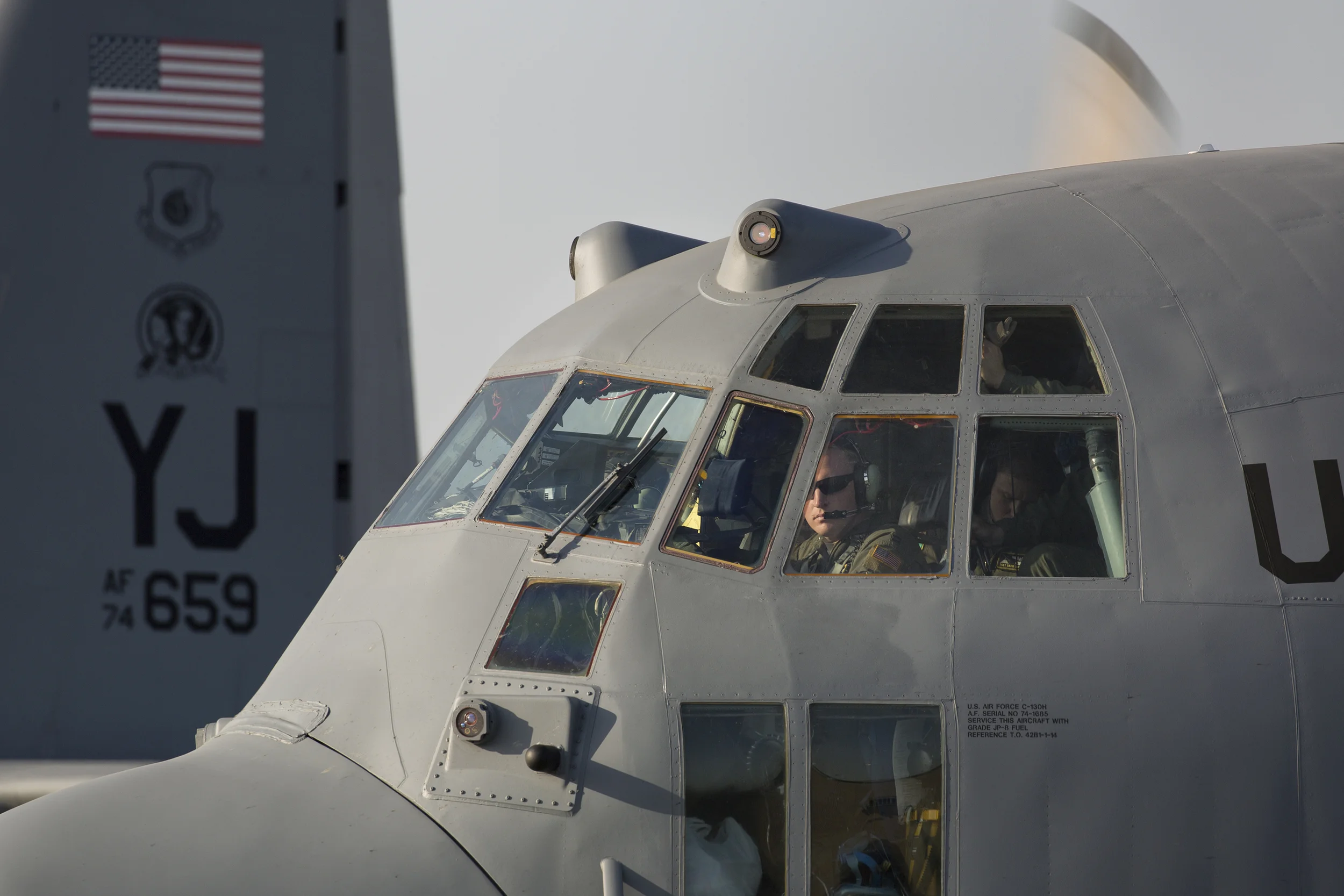 Capt. Christopher Weaver, 36th Mobility Response Squadron pilot, conducts preflight checks at Yokota Air Base, Japan, May 5, 2015. Airmen departed Yokota to support the U.S. Agency of International Development and the Government of Nepal. (U.S. Air Force photo by Osakabe Yasuo/Released)