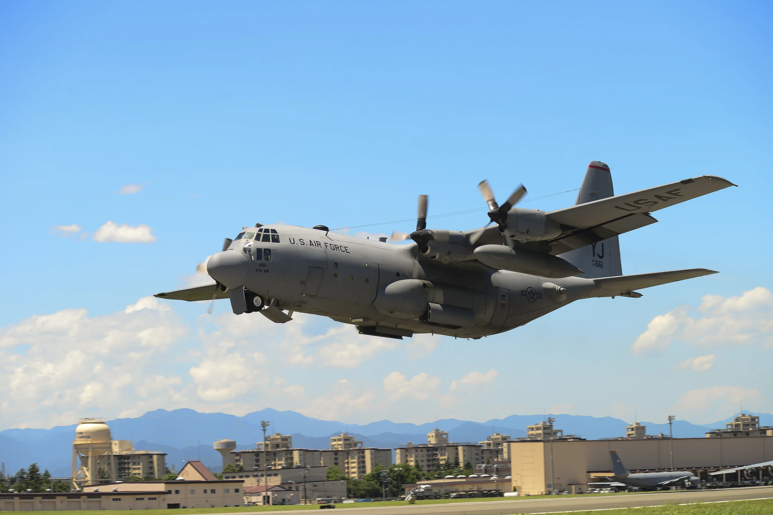 A C-130 Hercules takes off during a training exercise at Yokota Air Base, Japan, July 14, 2015. Ten C-130s participated in the exercise which tested the 36th Airlift Squadron’s ability to perform large formation flights. (U.S. Air Force photo by Senior Airman David Owsianka/Released)