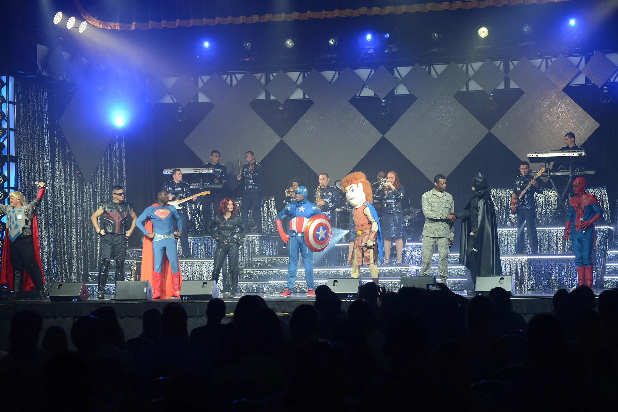 Members of the Tops in Blue dress as super heroes during their performance at Yokota Air Base, Japan, July 19, 2015. The show culminated in several songs paying tribute to U.S. service members. (U.S. Air Force photo by Airman 1st Class David C. Danford/Released)