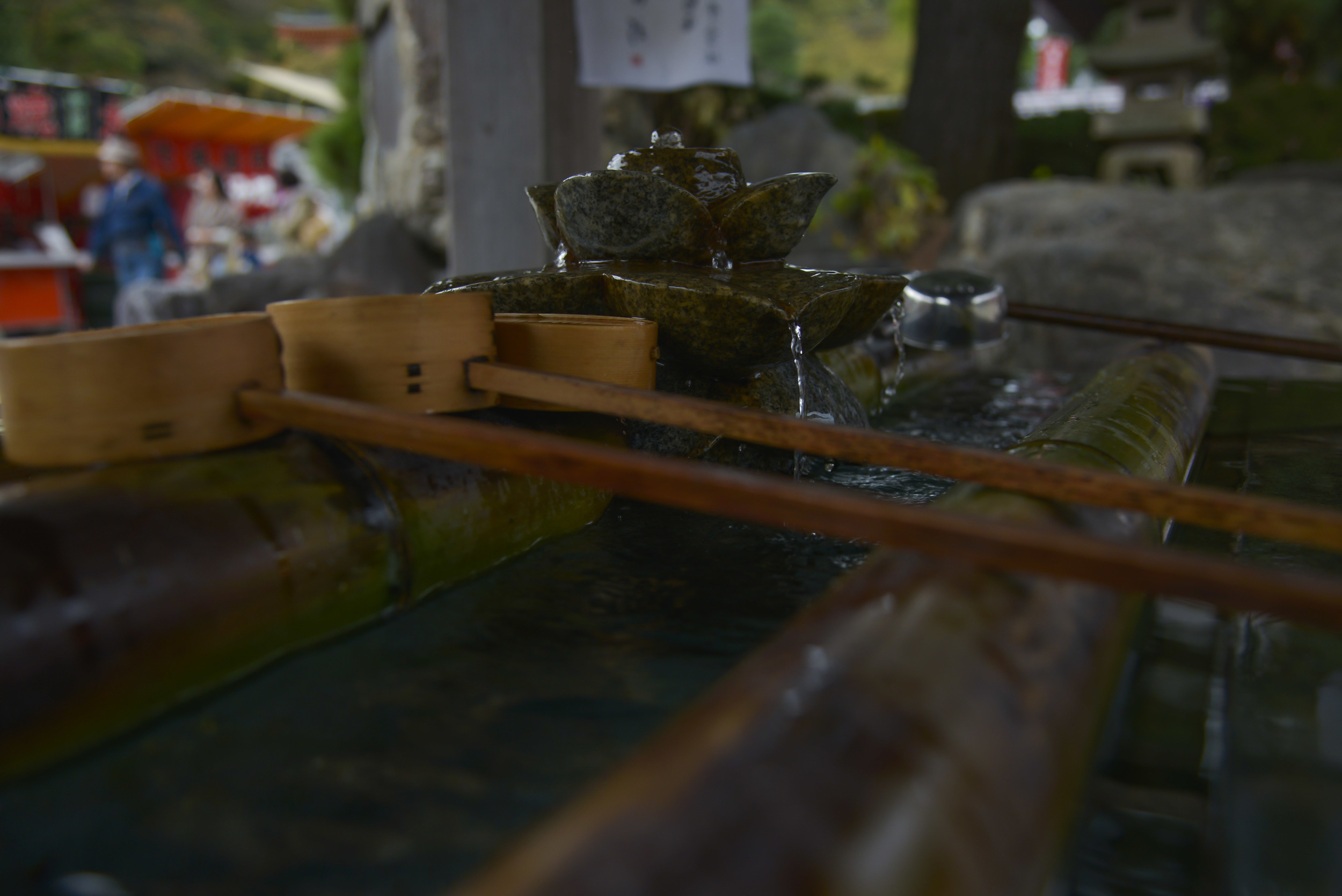 Water falls from a stone flower on top of a chuzo at the Takahata Fudo Temple grounds in Hino City, Japan, Nov. 1, 2015. Chozu’s are used to purify a person’s hands and mouth before they pray. (U.S. Air Force photo by Senior Airman David Owsianka/Released)
