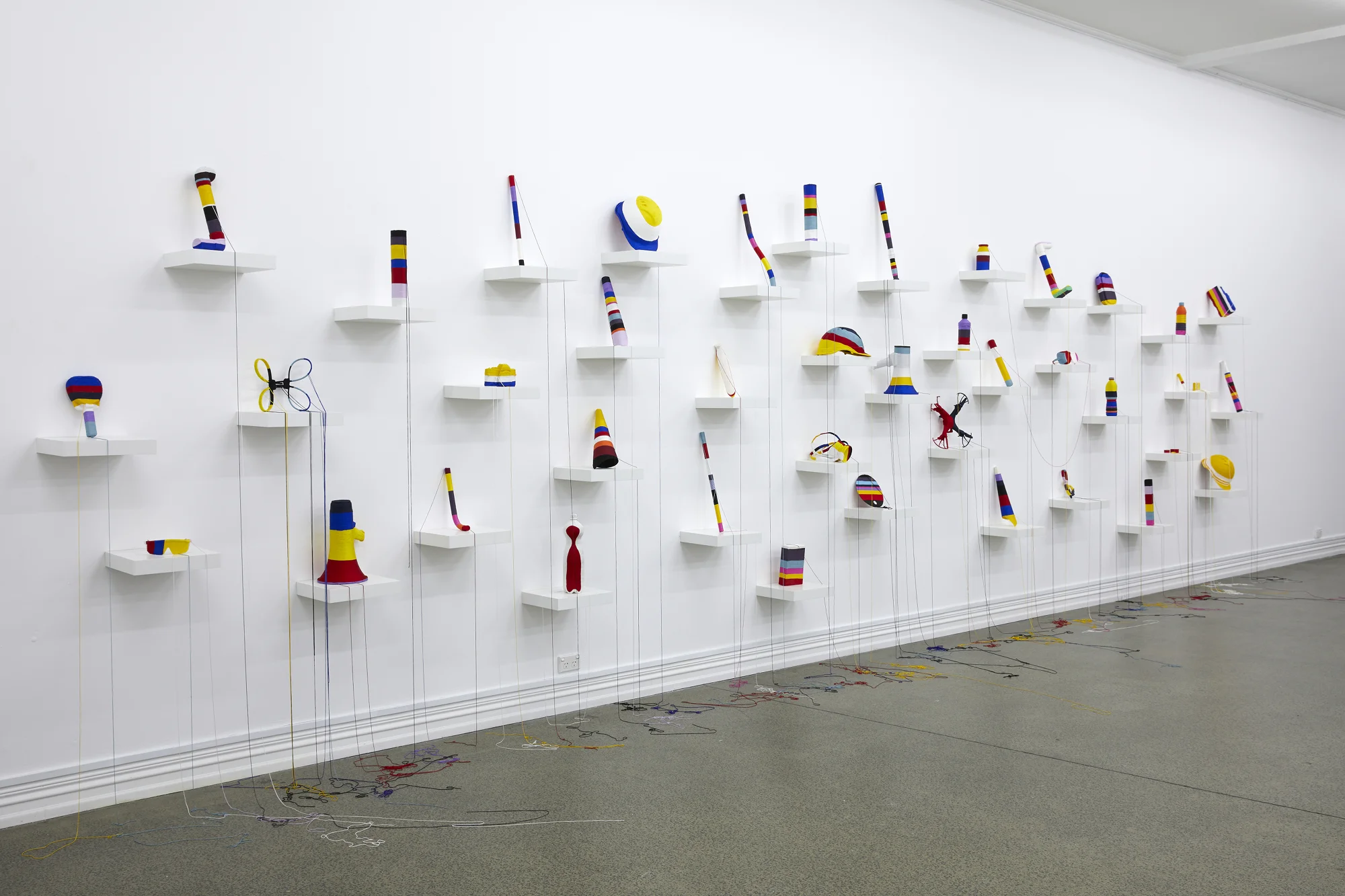 Yuk King Tan, Crisis Of The Ordinary , 2019, string, collected protests objects from Hong Kong, Korea and New Zealand, dimensions variable