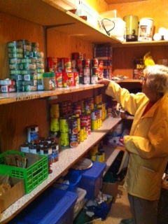 Volunteer Joy Huntley stocks the shelves