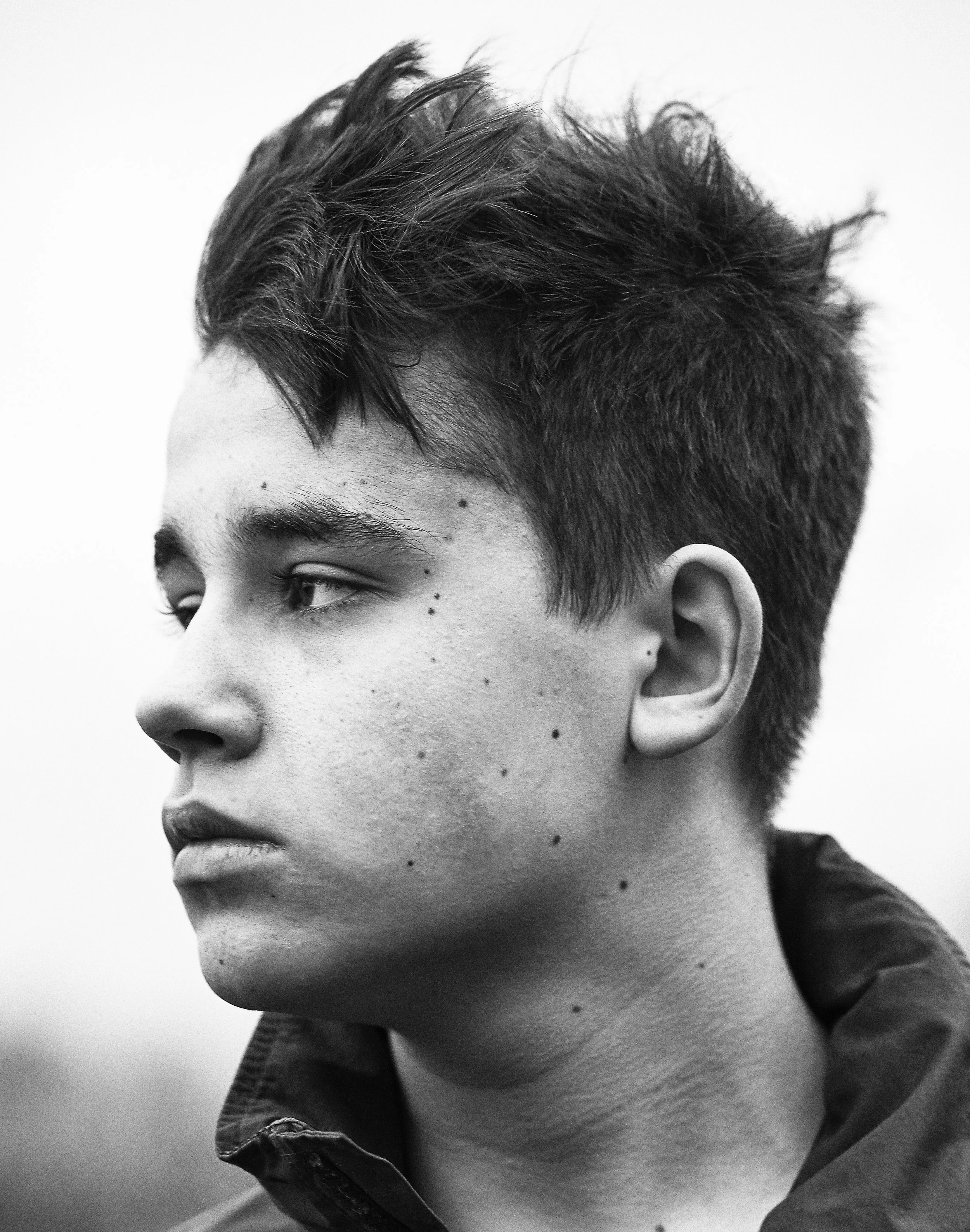 Strong portrait close-up of teenage boy