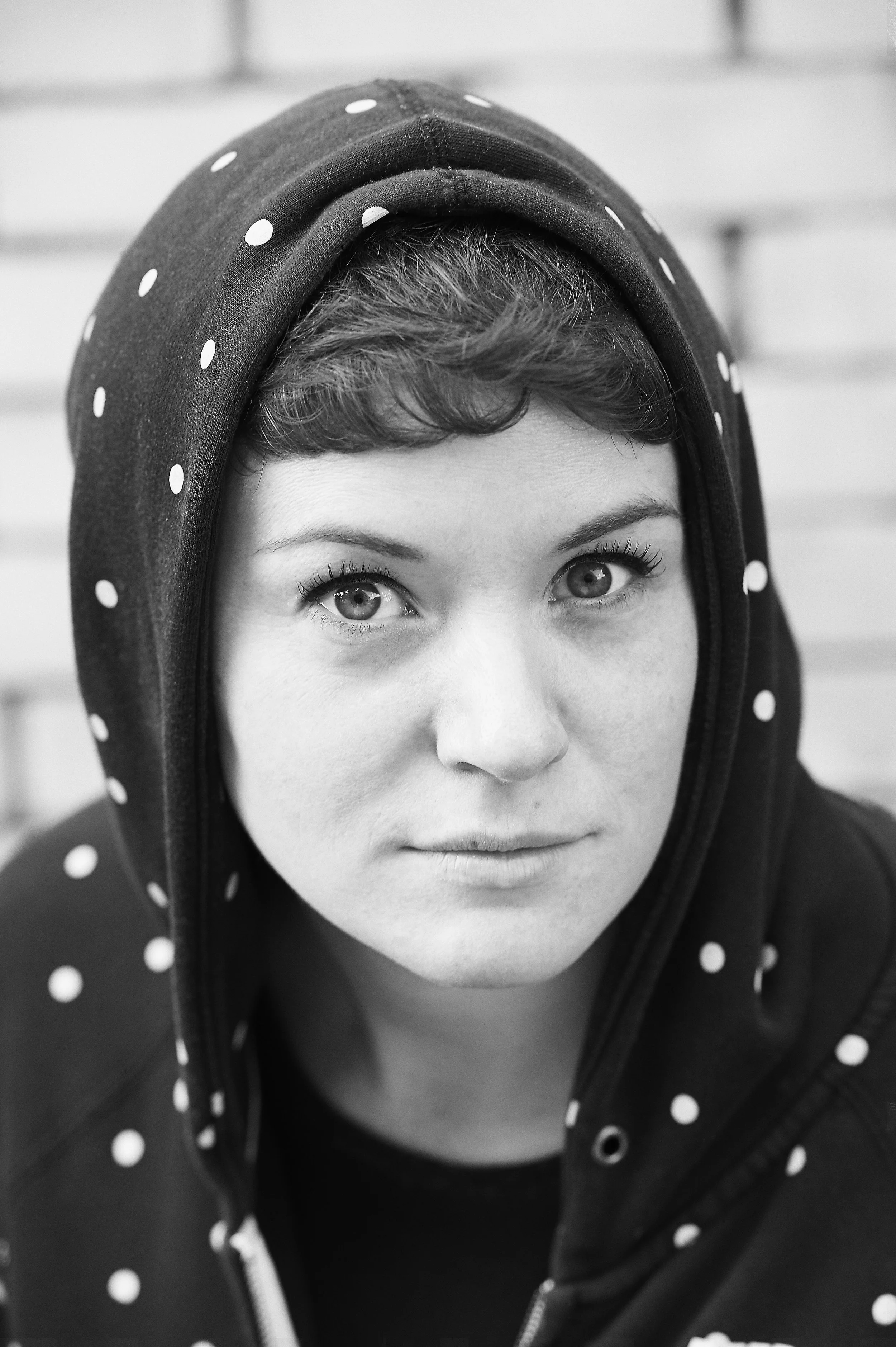 Woman in polka-dot hoodie by photographer Amanda Eatwell