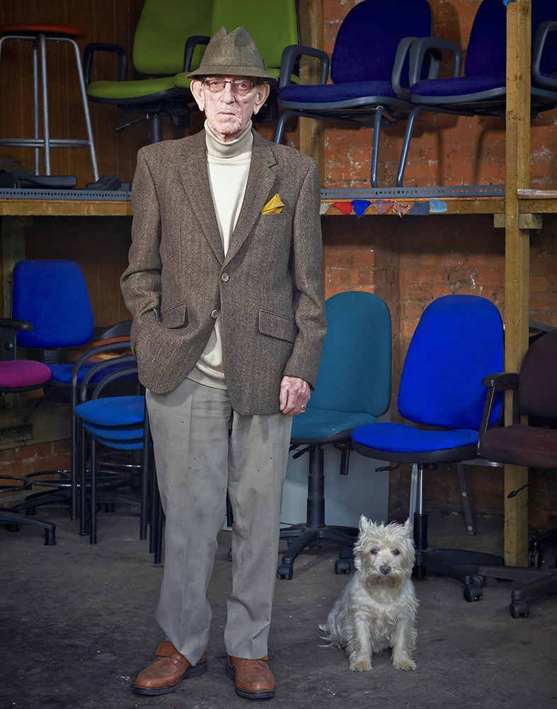 Portrait of a Smartly Dressed Older Man and His Dog