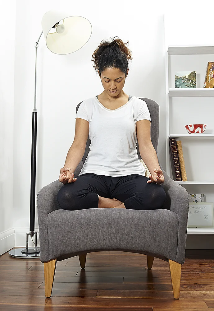 photograph of woman meditating