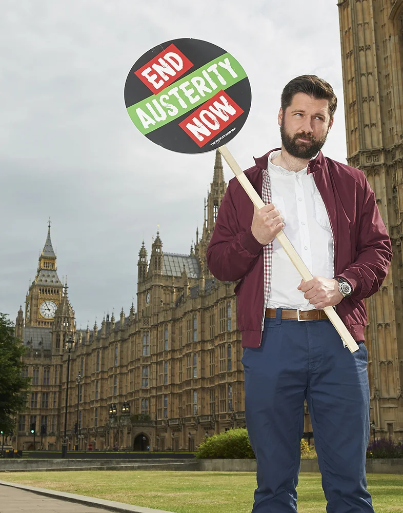 Man protesting austerity measures, by London photographer Amanda Eatwell