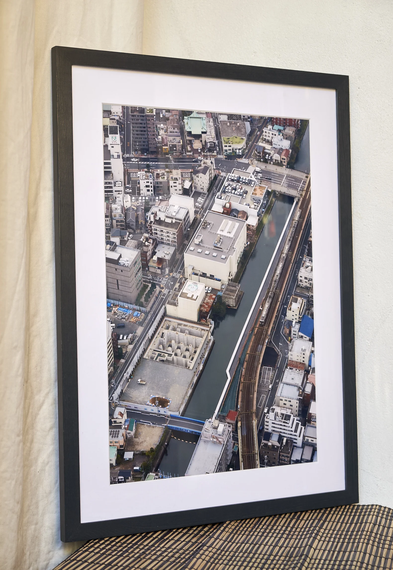 Up on the Roof Taken from 300 metres high in Tokyo's Sky Tower, allowing unique views over the city. This is part of a series of six images which was recently exhibited with London Independent Photography. Frame Size approx. 23 x 17", painted in a dark, oily blue. COST £75.00