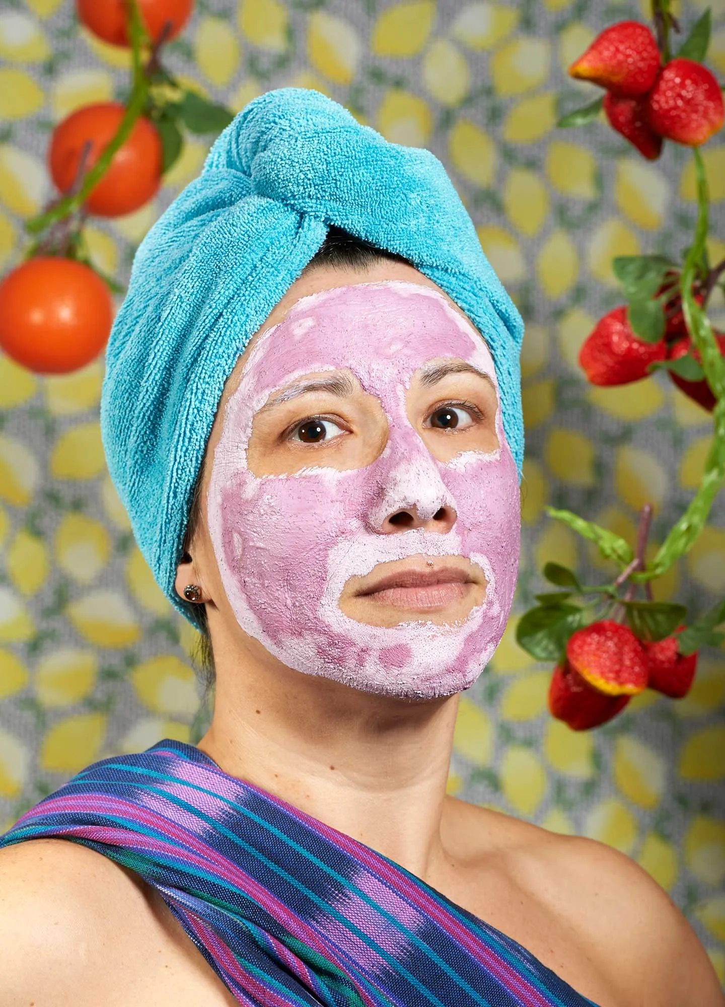 A strong photographic portrait of a woman wearing a fruity face pack