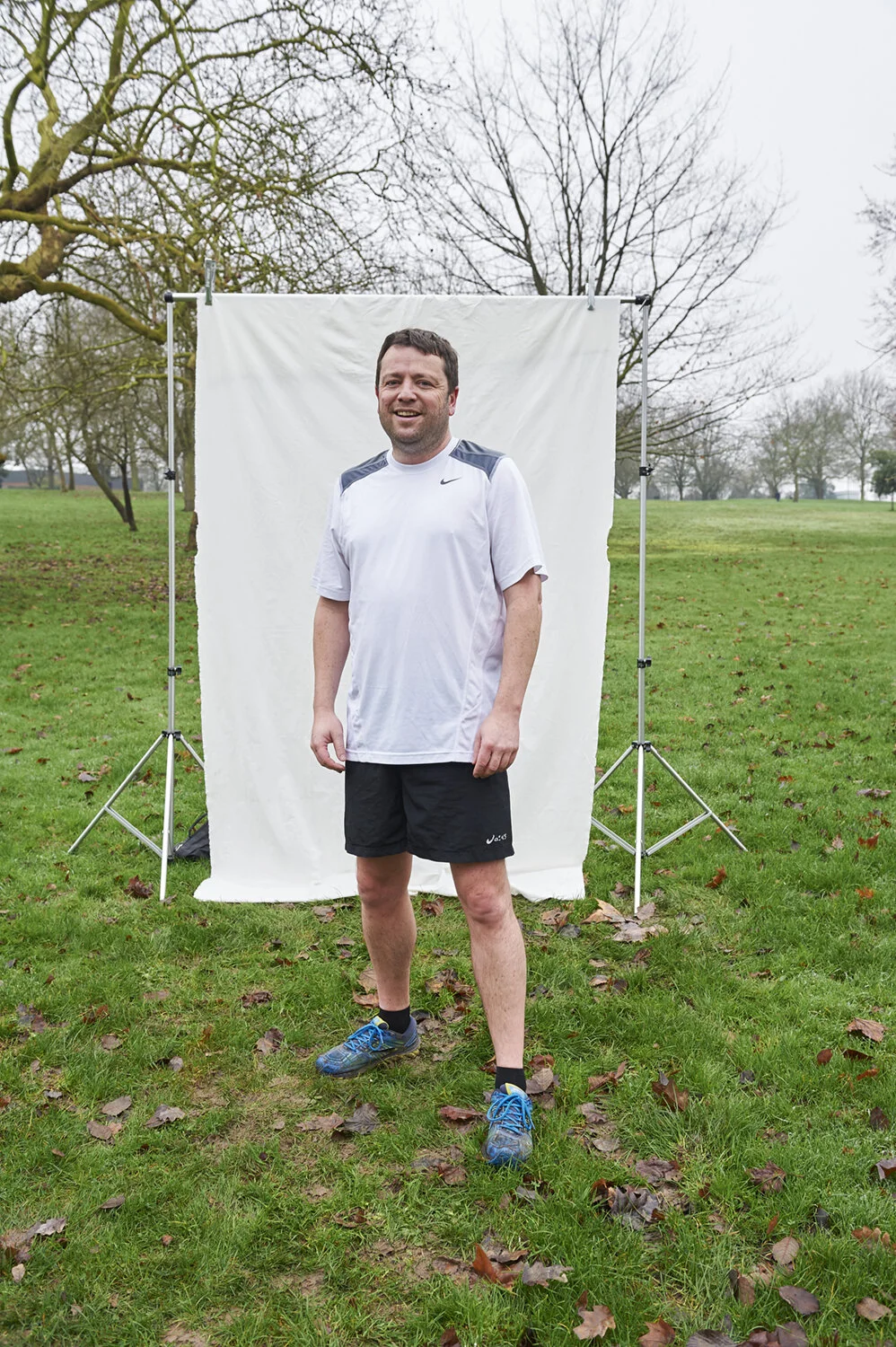 A man poses for a picture in the park by Amanda Eatwell