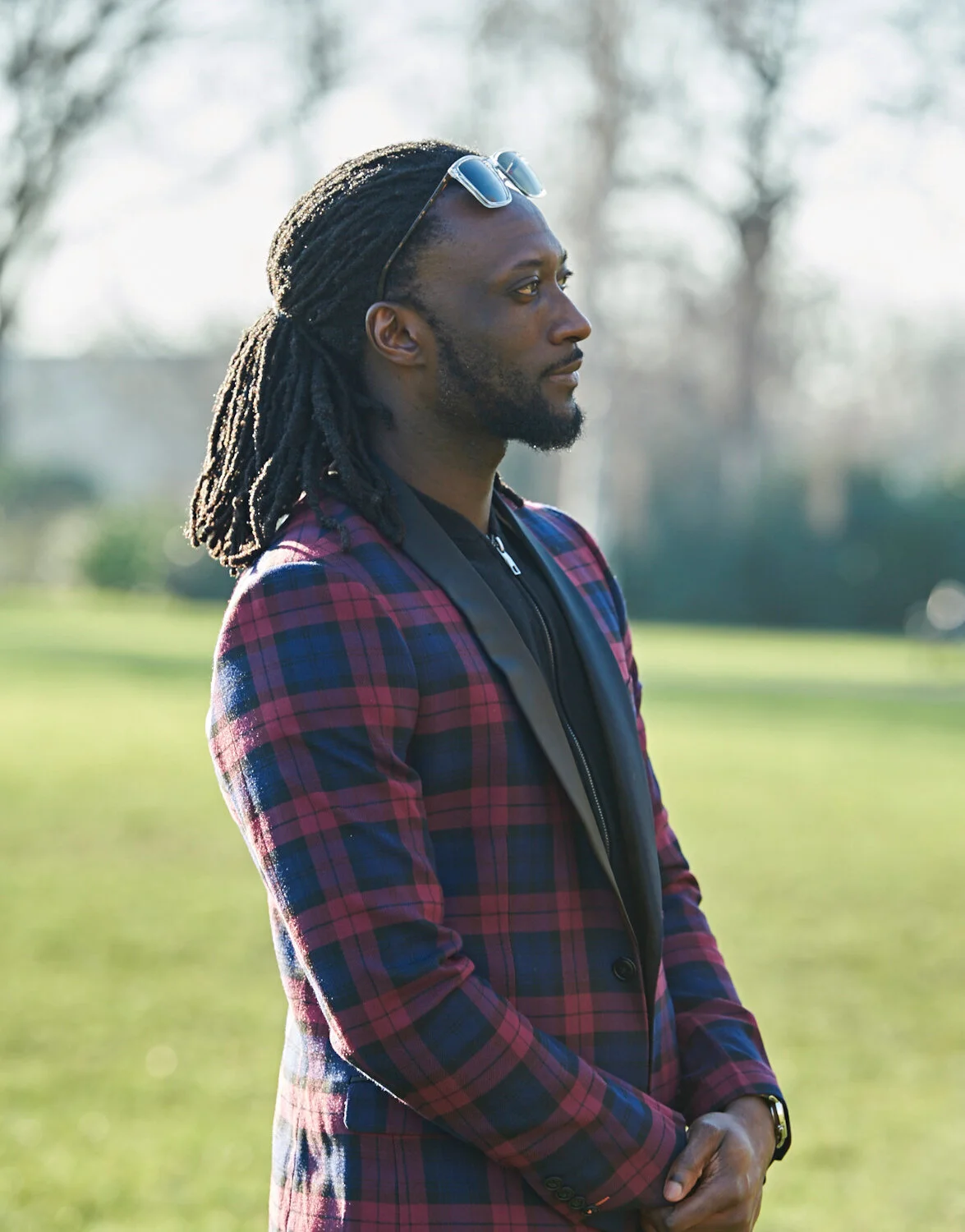 Profile photograph of a man with plaited hair by Amanda Eatwell